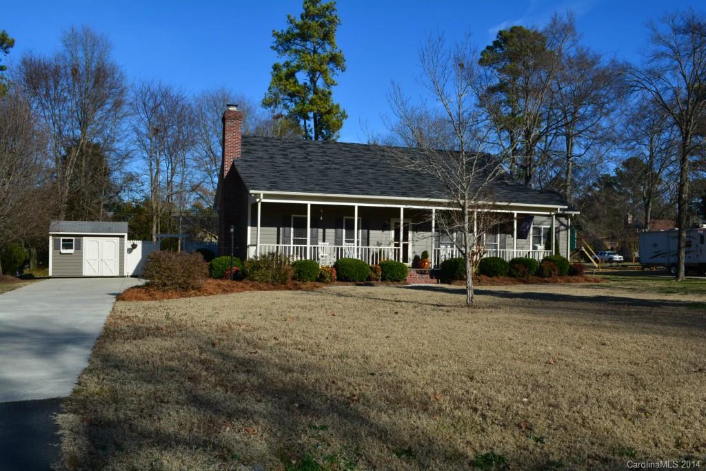 Gorgeous ranch style home with full front porch and half acre lot-no city taxes! 9 ft ceilings throughout. Perfect master suite- 2 walk in closets, uniquely high tray ceiling w/moldings, whirlpool tub & separate shower, heated ceramic floor. Spacious kitchen w/plenty of cabinets & countertop space and nice pantry. Large laundry room! Molding throughout home adds a warm touch. Gas fireplace in great room. Nice deck in private back yard. Great house you can't miss!