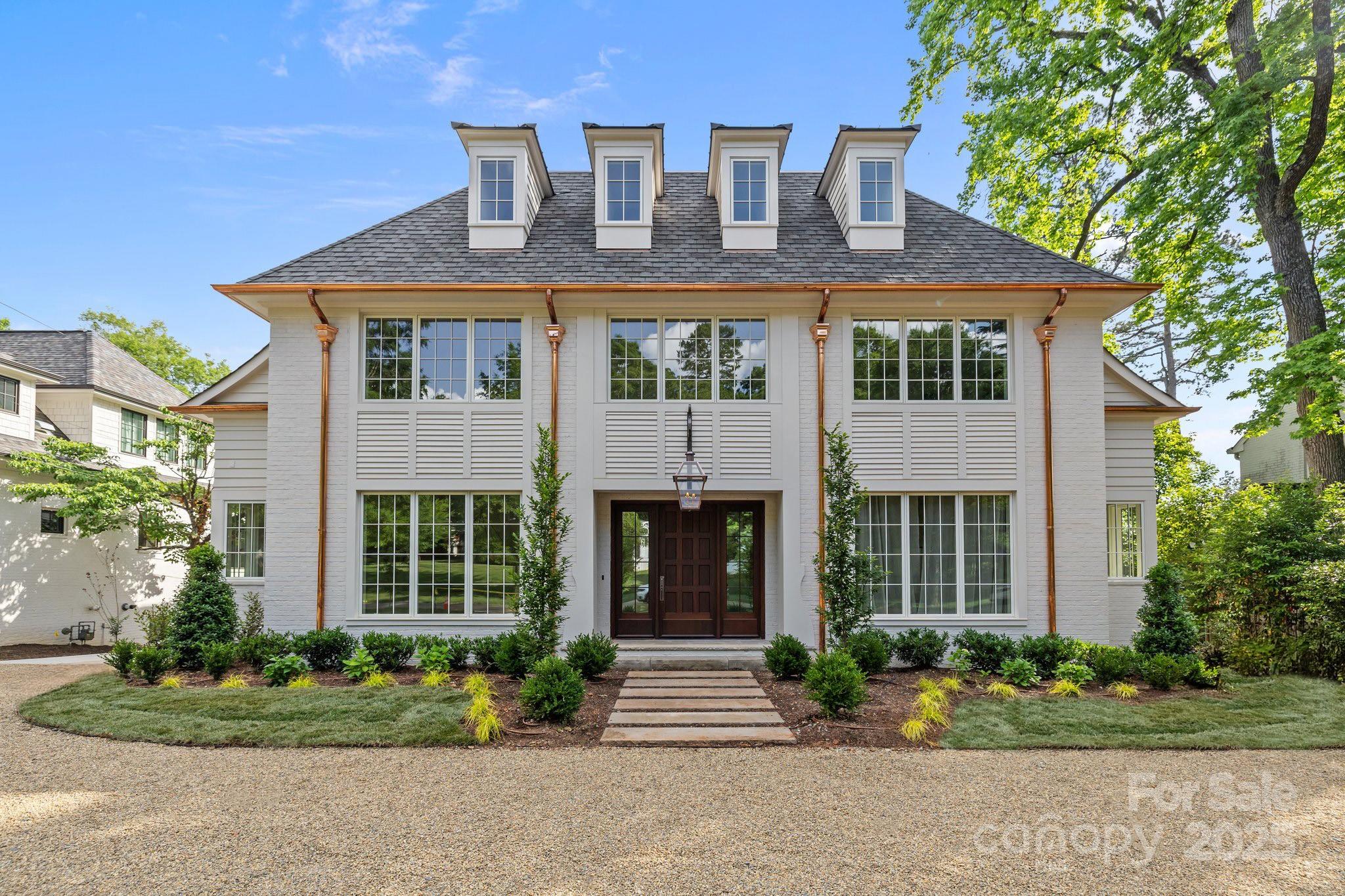 Stunning new construction in Myers Park! Blending timeless elegance with modern comforts, this thoughtfully crafted home by Aaron Cote Architecture & Thompson Building Group is one of a kind. The entry & formal dining room flows into an open-concept layout, featuring a spacious family room with fireplace & custom built-ins, chef’s kitchen with large center island, marble countertops, high end appliances, & butler's pantry - offering plenty of storage. The drop zone, office & incredible primary suite on main provide comforts & functionality for the family. The upper levels feature generously sized bedrooms with en-suite baths offering privacy along with multiple flex spaces for entertainment, office, exercise - suited to your lifestyle! The covered porch with fireplace, Detached 2-car garage, Copper Gutters & custom Mahogony front door, are just a few of the fabulous details in this exceptionally designed home!
