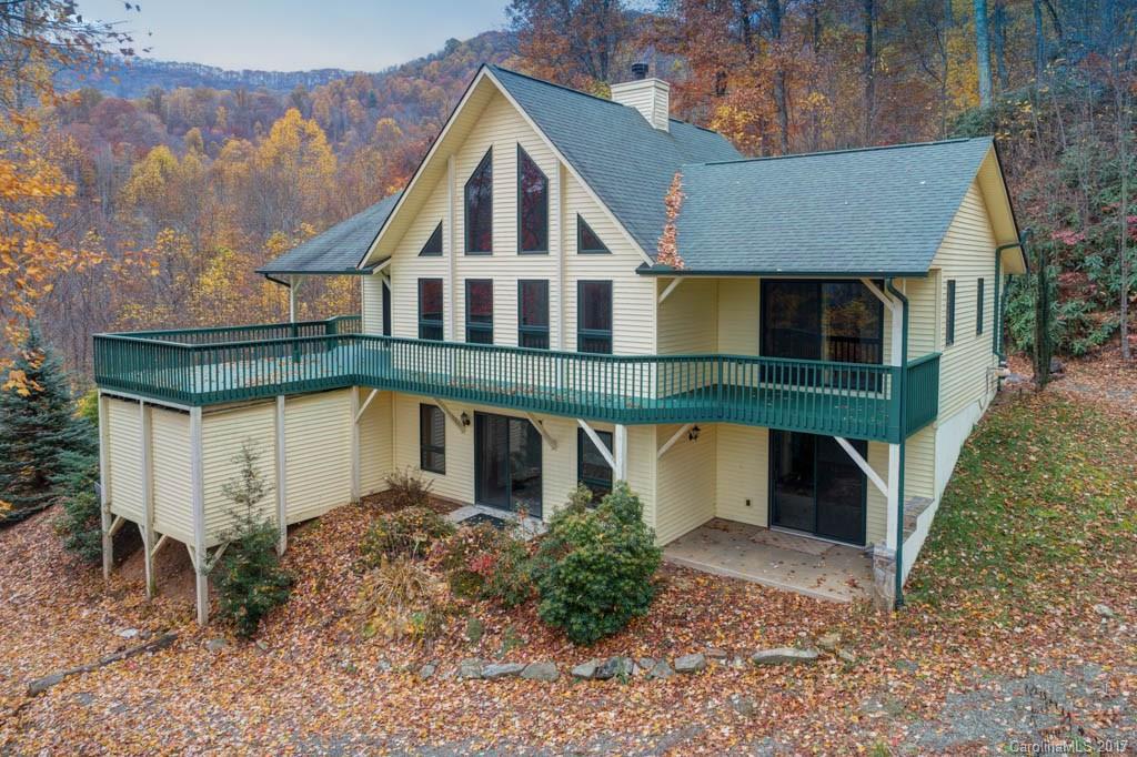 See Long-Range Views from spacious Porch and 2-Story Great Room with Stone Fireplace, Wood Beams, T&G ceilings. This Beautifully-Maintained 3/2.5 Mountain House, in a Private & Quiet setting, has Open Floor-Plan, Hardwood Floors, Central Vacuum, Big Kitchen, plenty of cabinets & counter space, an Island & a Pantry - Large Laundry Room on main floor, Garage-Shop with enclosed Work Area, Driveways to both levels - very light restrictions, but NO active HOA. Includes Add'l Parcel # 7699-69-5134.