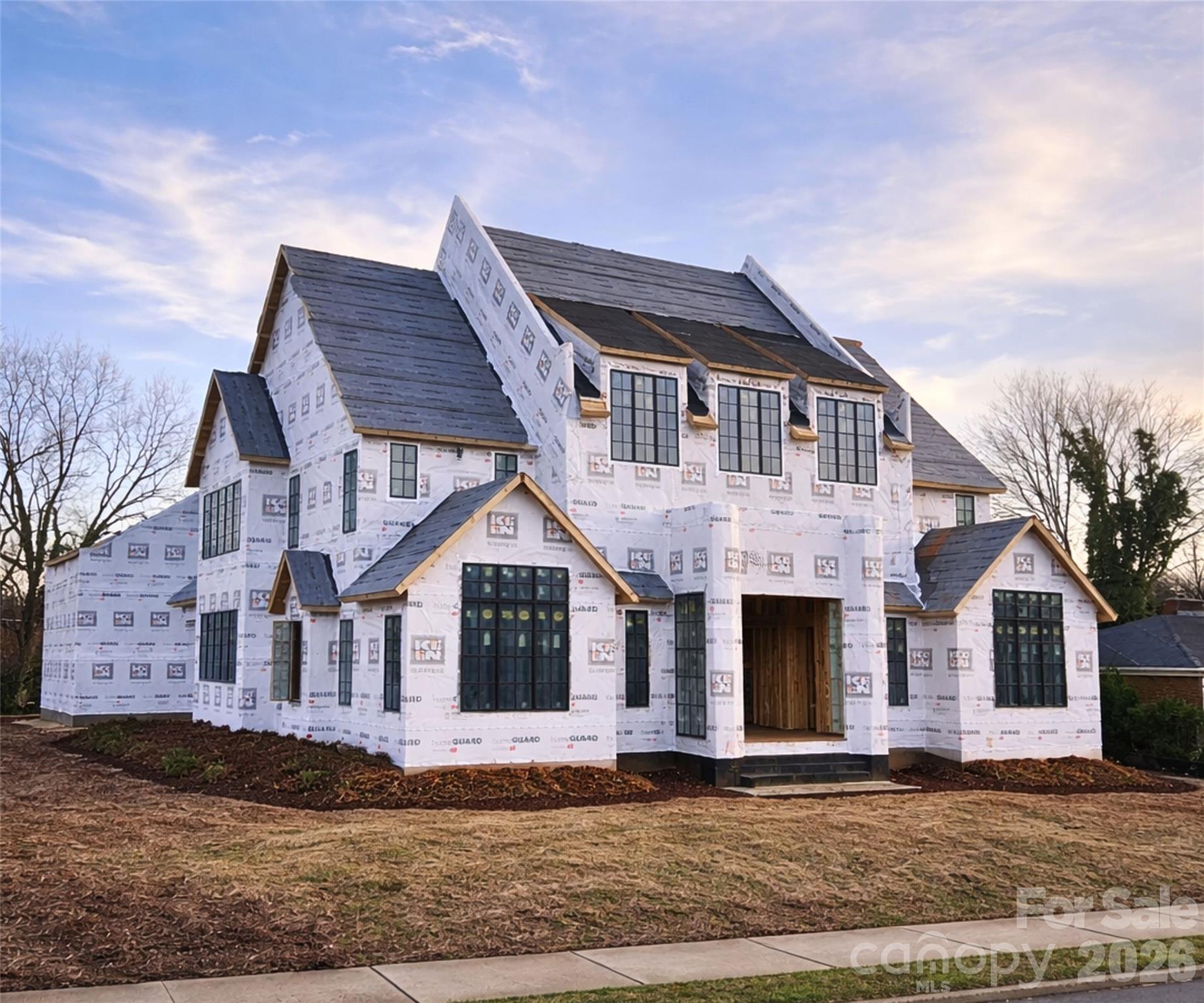 1240 Paddock Circle is a stunning new construction by Keen Building Company, showcasing exceptional craftsmanship and thoughtful, high-end design throughout. A dramatic 6-foot-wide pivot door opens to a grand foyer with soaring 25-foot ceilings, immediately setting the tone for this impressive home. The thoughtfully designed floor plan features a sophisticated lounge, a primary suite on the main level, and a show-stopping kitchen with paneled Sub Zero column refrigerators, multiple wine displays, and a spacious scullery with an extensive appliance package. Additional main-level highlights include a formal office and seamless living spaces ideal for both everyday living and entertaining.
Upstairs, you’ll find a bonus room with a bar area and a junior primary suite, offering flexibility for guests or multigenerational living. The detached three car garage includes a fully finished living space above, complete with a kitchenette, full bathroom with sauna, and a large flex room that is perfect for a guest house, gym, entertainment space, or private workspace.
Outdoor living is equally impressive, featuring a modern automatic louvered pergola, a sunken fire pit with seating, and a striking water feature wall. This home offers an unparalleled opportunity to enjoy every luxury and living space needed to truly never leave home.