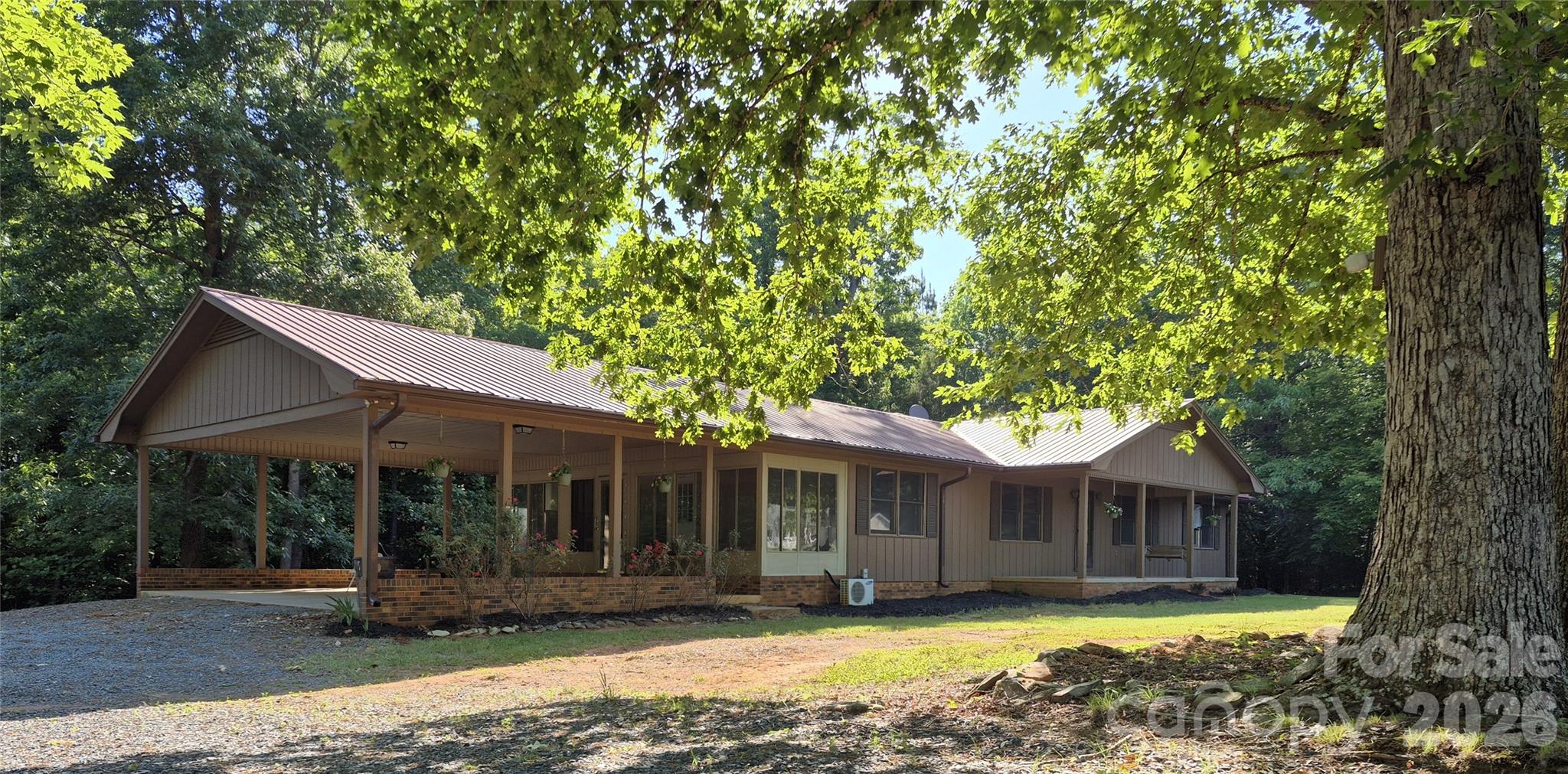 A CRAFTMANS DREAM IN THE HEART OF THE UWHARRIE MOUNTAINS! Make your escape to the 3 bedroom, 2 bath ranch with full unfinished basement. The home provides comfort and is move-in ready with recently remodeled main living, featuring an open floor plan with a kitchen, breakfast area and den with fireplace gas logs, as well as a spacious living room/dining area, sunroom and laundry room. A new rear deck and attached two car carport may be accessed from the main level. The basement is unfinished and ready for you to grow! It features wood burning fireplace and wood burning stove. There is also a ruffed in full bath. The basement has also been incapsulated and comes with a warranty. The property which is approximately two plus or minus acres, includes a workshop, wired with wood stove, wall AC unit, and half bath. A two car detached carport and two car detached garage providing space for creative ventures.