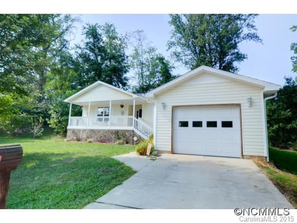Move-in Ready 1 level home with garage! Hard to beat this price inside city limits! Loads of updates including oak hardwood floors in main areas, rear addition with large family room, walk-in storage and enlarged master bath with 2 vanity sinks, open concept floor plan, cvd.front porch, open rear deck and patio, terraced landscaping with fire pit, near level culdesac yard, oversized garage with storage, in small neighborhood of similar homes