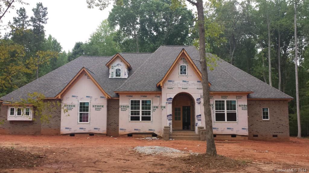 Under Construction! What glorious attention to detail in this Gorgeous Brick & Stone Home situated on over 2 acres! Step through Mahogany front doors to enjoy travertine floors with intricate inlay. Hardwoods, Granite throughout. Beautiful tile work. Architectural Arches & Niches. Master on Main. Fireplace in Great Room. 2nd Fireplace in Upstairs Bonus Room. 2 Surround Sound systems, Wooden shelving in all closets/ pantries. Covered Porch overlooks large stamped concrete patio. Clover Schools.