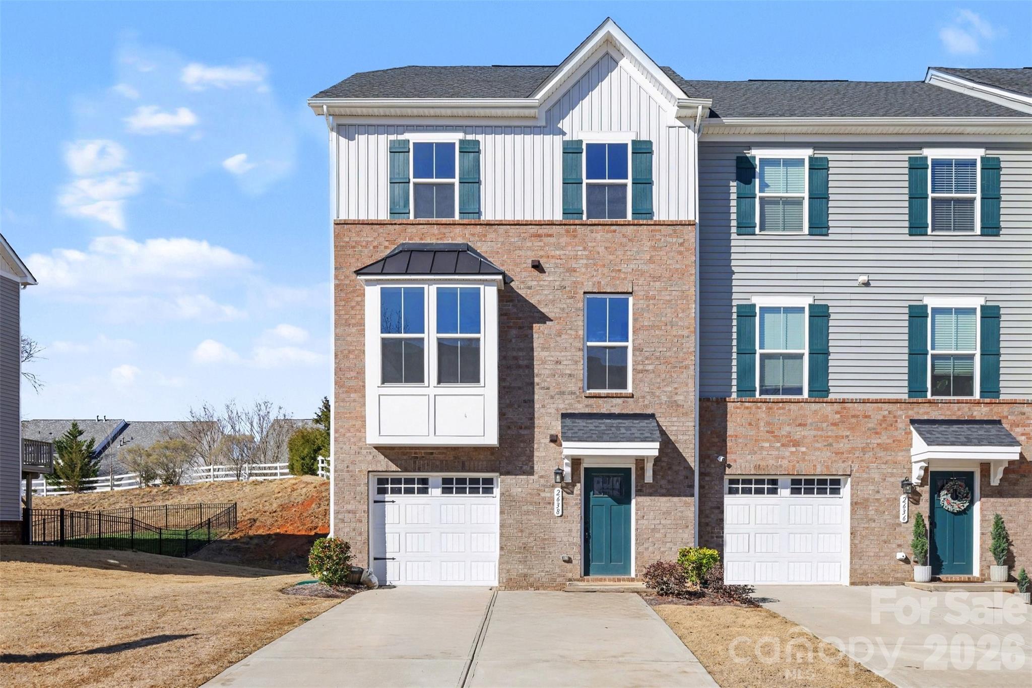 Welcome to this beautiful end-unit townhome offering 3 bedrooms, 2 full baths, and 2 half baths—thoughtfully designed with a bathroom on every floor for ultimate convenience—along with a spacious lower-level bonus room ideal for a home office, media room, workout space, or private guest retreat. The open-concept main level is designed for both everyday living and effortless entertaining. A bright and airy living space flows seamlessly into the modern kitchen, showcasing stylish cabinetry, beautiful countertops, and ample workspace. The adjoining dining area opens to a private deck, creating the ideal setting for indoor-outdoor living. As an end unit, the home is filled with abundant natural light throughout the day, enhancing its warm and inviting feel. Upstairs, you’ll find three generously sized bedrooms, including a beautiful primary suite featuring an elegant tray ceiling, walk-in closet, dual vanities, and a tiled shower. Enjoy resort-style community amenities, including a pool, pickleball and tennis courts, a playground, and more. Ideally located just minutes from Fort Mill’s top-rated schools, shopping, dining, and convenient access to I-77 and I-485, this home offers the perfect blend of comfort, style, and convenience.