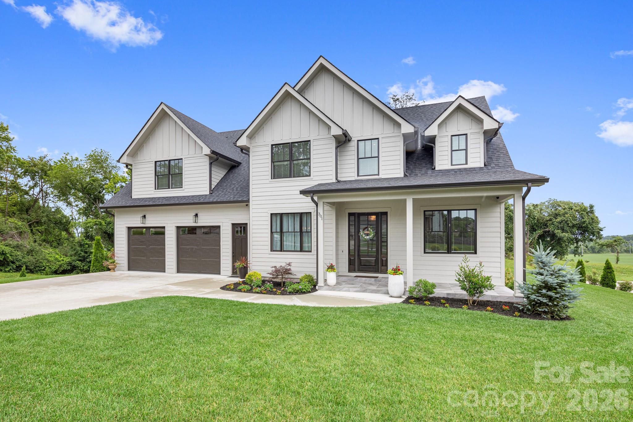Welcome to this stunning 4,400 sq ft home located in the highly sought-after Hollabrook Farm subdivision, where luxury, space, and mountain views come together seamlessly. This beautifully custom designed 4 bedroom, 4.5 bathroom home offers exceptional craftsmanship and thoughtful details throughout.

Step through the front doors and you’re greeted by soaring 10-foot ceilings and rich hardwood flooring that flows throughout the main level. A private office sits to your right, while a spacious formal dining room is located to your left—perfect for entertaining. Continuing into the heart of the home, the open-concept great room features a gas fireplace and expansive windows that fill the space with natural light.

The chef’s kitchen is a true showstopper, complete with a large quartz waterfall island, 5-burner gas cooktop, and not one but two walk-in pantries, offering both style and functionality.

The primary suite on the main level is a private retreat, featuring a large walk-in closet and a luxurious ensuite bath with dual vanities, elegant tile flooring, a walk-in shower, and a soaking tub positioned to take in the serene backyard and long-range mountain views. The laundry room is conveniently located on the main level just off the primary suite.

Upstairs, a custom-designed staircase leads to three additional bedrooms, each with its own private bathroom. One bedroom even includes a hidden secret room, adding a unique and fun touch. You’ll also find an additional office, a spacious flex room, and a large bonus room—offering endless possibilities for work, play, and relaxation.

Situated on a flat lot, the backyard is truly special, featuring breathtaking long-range mountain views with no homes behind you, providing both privacy and a peaceful setting.

Hollabrook Farm offers incredible community amenities including a clubhouse available for hosting guests, a 7-acre stocked fishing lake with piers, a pool, and a pavilion—perfect for enjoying the neighborhood lifestyle. Conveniently located just minutes from the airport, Biltmore Park, and an abundance of dining and shopping options, this home offers the perfect balance of accessibility and privacy.

This is a rare opportunity to own a spacious, thoughtfully designed home in one of the area’s most desirable communities—offering room to live, entertain, and truly enjoy mountain living.