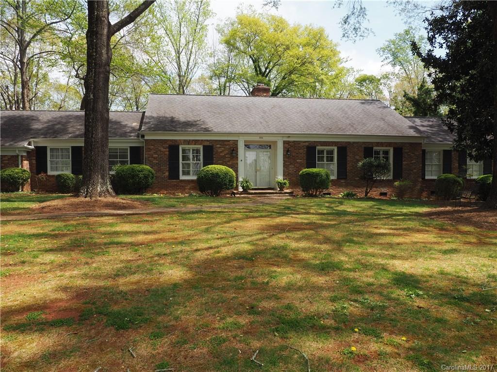 Straight out of Southern Living this sprawling brick ranch in desirable NW Hickory features 3 BR, 3 full and one half bath, LR, great room, DR, breakfast nook, laundry room & spacious screened porch. Downstairs is a den, the BR & third full bath. All rooms are generously sized. The kitchen with granite counter tops opens to the great room which has a beamed ceiling, fireplace, built-ins and sliding doors leading to the spacious screened porch. Three FPs. Heavy molding throughout main level.