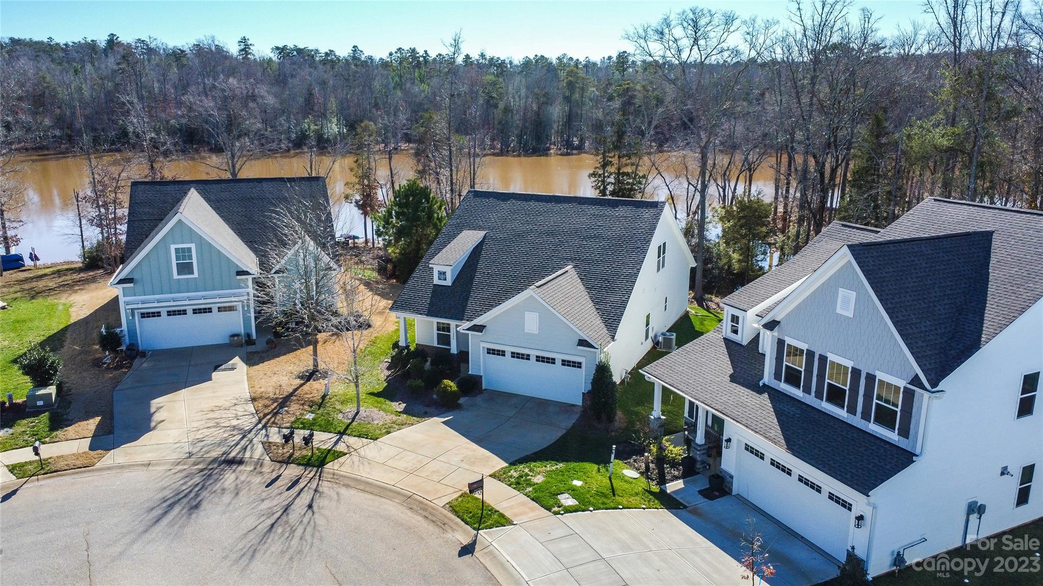 Welcome to your dream home in the prestigious Edgewater community, where elegance meets serene lakeside living. This exquisite 3 bed/3 bath boasts unbeatable views of the lake. Your journey begins as you walk through the front door, greeted by stunning views of Fishing Creek Lake through full glass windows & large sliding doors. The open floor plan, featuring a spacious Dining, Kitchen & Great Room, sets the stage for both relaxing & entertainment. Natural light floods in to highlight the wood floors & elegant granite countertops. Enjoy the ease & comfort of the main-level primary bedroom, complete with a spacious en-suite, walk-in closet & elegant trey ceiling, blending convenience with serene luxury. Savor your coffee on the porch or take a stroll in the backyard. Each moment graced by stunning lake views, offering a serene, picturesque backdrop. Explore an upstairs bonus/bedroom, two main floor bedrooms, a large kitchen island & ample storage. Schedule your tour today!