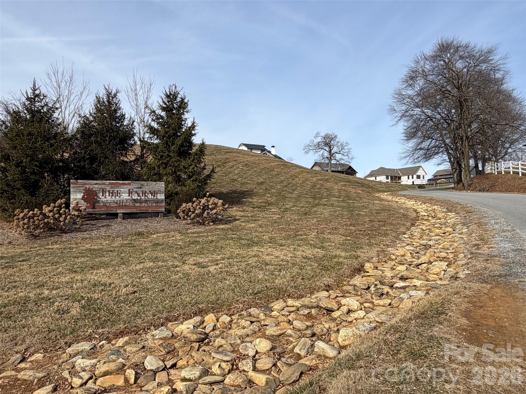 Beautiful .77-acre homesite located in the highly desirable subdivision of The Farm at Mills River. This gently sloping lot offers an excellent building site within a thoughtfully planned community known for its open green spaces and scenic surroundings. Residents enjoy access to community amenities including walking trails and shared outdoor gathering areas, creating a true neighborhood feel. With more amenities still to be developed. Conveniently located near Asheville, Hendersonville, and Asheville Regional Airport, with easy access to shopping, dining, and outdoor recreation. A wonderful opportunity to build your custom home in one of Mills River’s most sought-after communities.