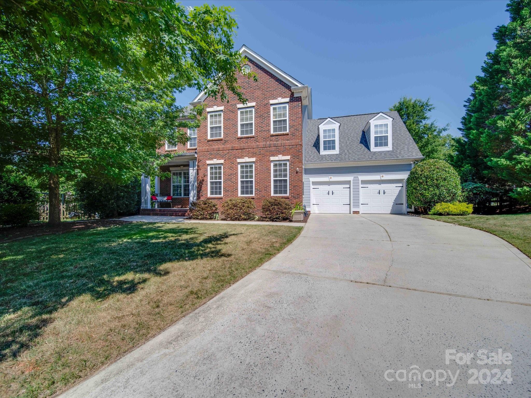 Gorgeous home in the sought after neighborhood Lake Shore of Tega Cay. From the moment you enter the home you will fall in love w/the open floor plan w/natural light & fresh paint. Refinished hdwd floors on main level, stairs & hallway. Beautiful, elegant light fixtures thru-out. The lovely, spacious kit was updated in 2019 & features granite counters, huge center island, tons of cabinets, tile backsplash, gas range & black ss appliances w/sunny breakfast area. 2-story greatrm w/built-in & FP. Huge primary bedrm on main w/nice size bath w/2 separate vanities, garden tub, sep shower & walk-in closet. Upstairs are 3 nice sized bedrms & large bonus room w/custom, solid wood barn door. Hall bath has double bowl vanity, w/a Miseno spa soaker tub & tile surround. Custom built-in cabinetry/desk area is a plus. High end tankless water heater & Smart Home Thermostats. Premium, private, flat, large cul-de-sac lot w/extensive landscaping. Come enjoy all this home has to offer in Tega Cay.