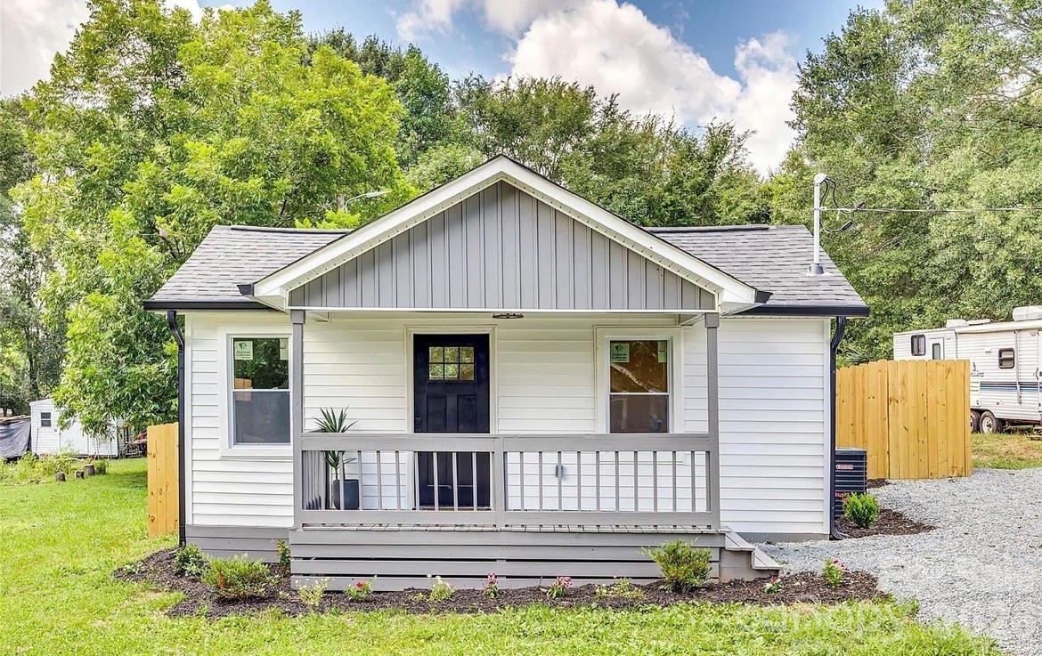 Fully renovated and move in ready home with modern updates throughout. Features fresh paint, granite countertops, and an open floor plan ideal for everyday living and entertaining. The kitchen includes all stainless steel appliances with washer and dryer to remain. Major upgrades include new vinyl siding, architectural roof and HVAC in 2023, and energy efficient windows. Interior offers new vinyl plank flooring throughout with new carpet in the living room and main bedroom while maintaining vinyl flooring underneath. Bathroom features tile surround tub to the ceiling. Additional highlights include ceiling fans in bedrooms, updated lighting in the living room, kitchen, and bathroom, a covered rocking chair front porch, back deck, and a large fenced backyard ready for your personal touch to create the perfect outdoor space for relaxing or entertaining.