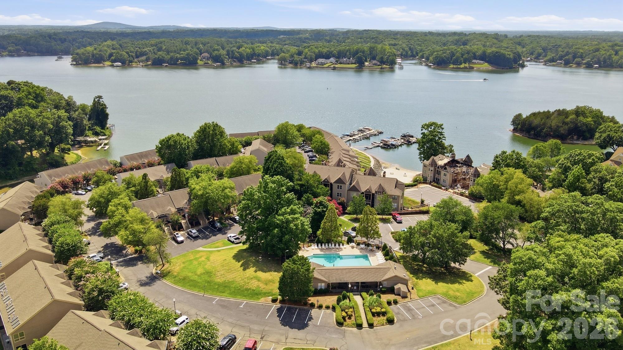 Welcome to The Yachtsman gated lake community on Lake Wylie! Whether you're looking for full time ultimate lake life living or a secondary getaway, The Yachtsman has it all. Private community beach, community pool, walking trails along the water, community dock, and boat storage (first come first serve) and boat slips (leased per availability), and much more! 

This renovated townhome invites you in with a chef's dream in the spacious and fully renovated kitchen, SS appliances, and spacious bar and island. Entertain or relax in comfort with an open living space and lake views, or take things upstairs to the private rooftop terrace overlooking Lake Wylie! This well maintained and updated home invites you in with ample lighting pouring through NEW windows through most of the home, both sliding glass doors replaced, modern renovations, and a turn key palette waiting for its new owner's personal touches. 

Each bedroom includes it's own private bathroom, all updated! Laminate wood flooring throughout the entire home means low maintenance living. Create private retreats, office/workspaces, ample areas for relaxation and entertaining and so much more with multiple levels of living space. 

When you are ready to explore you'll find Steele Creek shopping moments away full of options from grocery shopping, hotels, restaurants, Charlotte Premium Outlets and so much more. Come see for yourself what living in your own private lake retreat could look like!