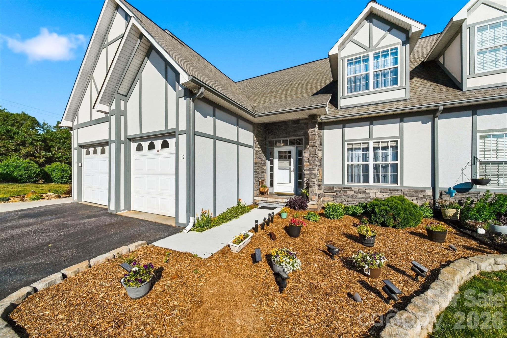 Lakefront Townhome – Your Serene Escape on Lake Hickory.  This charming townhome in the desirable Heron Cove community is your gateway to relaxed, lakeside living. With 3 bedrooms, 2.5 bathrooms, and around 2,100 sq ft of thoughtfully designed space, it effortlessly blends comfort with convenience.

Start your day sipping coffee on the screened-in porch, soaking in peaceful setting in this Bethlehem community, or cozying up by the gas fireplace in the inviting living room. The heart of the home—a bright, open kitchen and dining area—makes cooking, entertaining, and gathering with friends a true joy. Hardwood floors throughout add warmth and a timeless feel.

Upstairs are two spacious bedrooms with walk-in closets that offer serene retreats, while the shared full bath provides a touch of modern comfort. Downstairs, a finished lower level creates the perfect spot for a den, guest bedroom, or cozy movie night, with a patio just outside for grilling, relaxing, or enjoying evening sunsets.

This townhome comes with a single-car garage, extra parking, and even a Sea-Doo port, making it easy to embrace life on the water. Just steps away, enjoy your private community boat dock, take a leisurely walk to Wittenberg Access Boat Ramp, splash at the swim beach, or explore nearby walking trails. With local dining, shopping, and everything you need within reach, this home lets you savor the perfect mix of lakeside serenity and everyday convenience. Freshly painted in 2026 and ready for you to call it home!