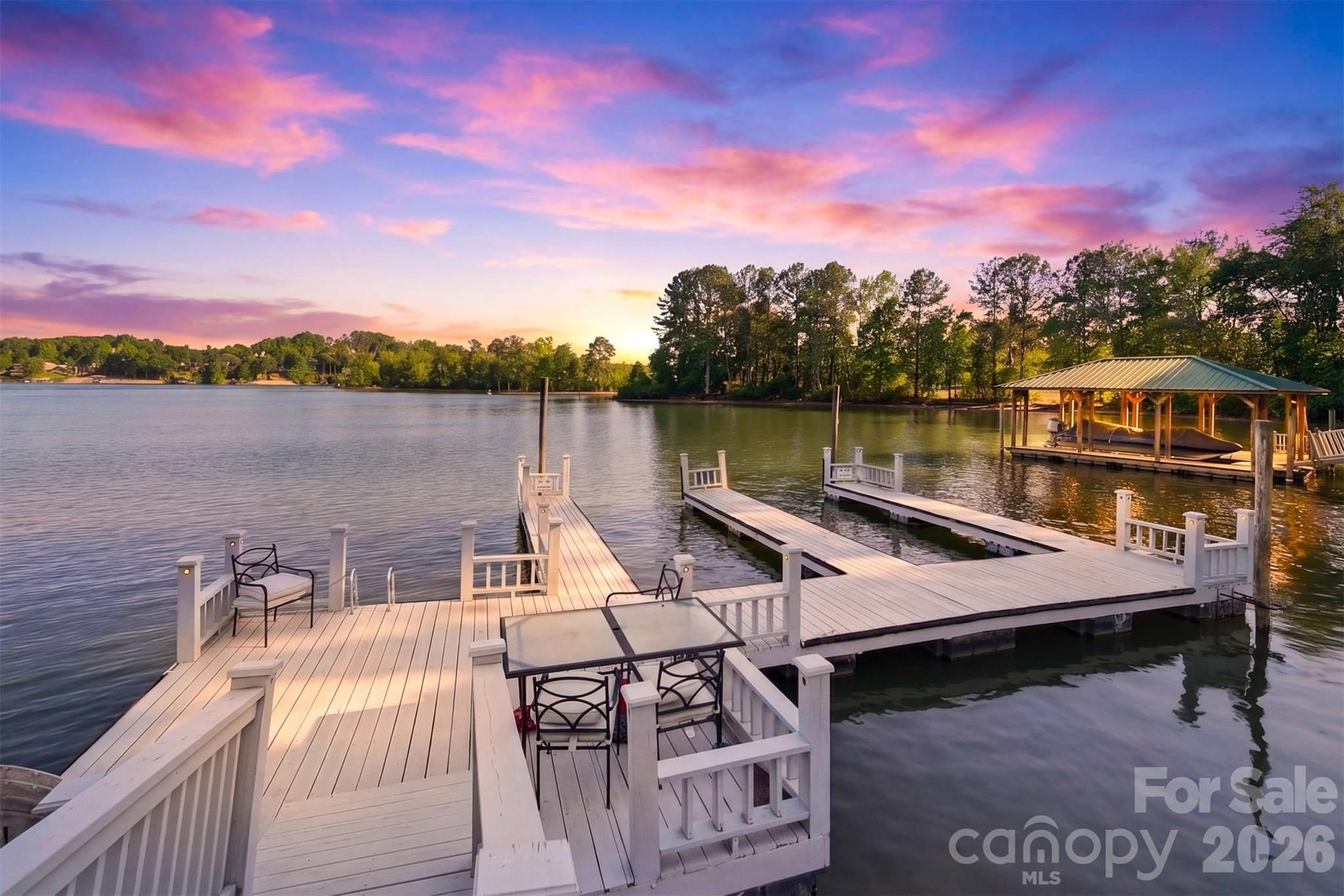 Lakefront Townhome – Your Serene Escape on Lake Hickory.  This charming townhome in the desirable Heron Cove community is your gateway to relaxed, lakeside living. With 3 bedrooms, 2.5 bathrooms, and around 2,100 sq ft of thoughtfully designed space, it effortlessly blends comfort with convenience.

Start your day sipping coffee on the screened-in porch, soaking in peaceful setting in this Bethlehem community, or cozying up by the gas fireplace in the inviting living room. The heart of the home—a bright, open kitchen and dining area—makes cooking, entertaining, and gathering with friends a true joy. Hardwood floors throughout add warmth and a timeless feel.

Upstairs are two spacious bedrooms with walk-in closets that offer serene retreats, while the shared full bath provides a touch of modern comfort. Downstairs, a finished lower level creates the perfect spot for a den, guest bedroom, or cozy movie night, with a patio just outside for grilling, relaxing, or enjoying evening sunsets.

This townhome comes with a single-car garage, extra parking, and even a Sea-Doo port, making it easy to embrace life on the water. Just steps away, enjoy your private community boat dock, take a leisurely walk to Wittenberg Access Boat Ramp, splash at the swim beach, or explore nearby walking trails. With local dining, shopping, and everything you need within reach, this home lets you savor the perfect mix of lakeside serenity and everyday convenience. Freshly painted in 2026 and ready for you to call it home!
