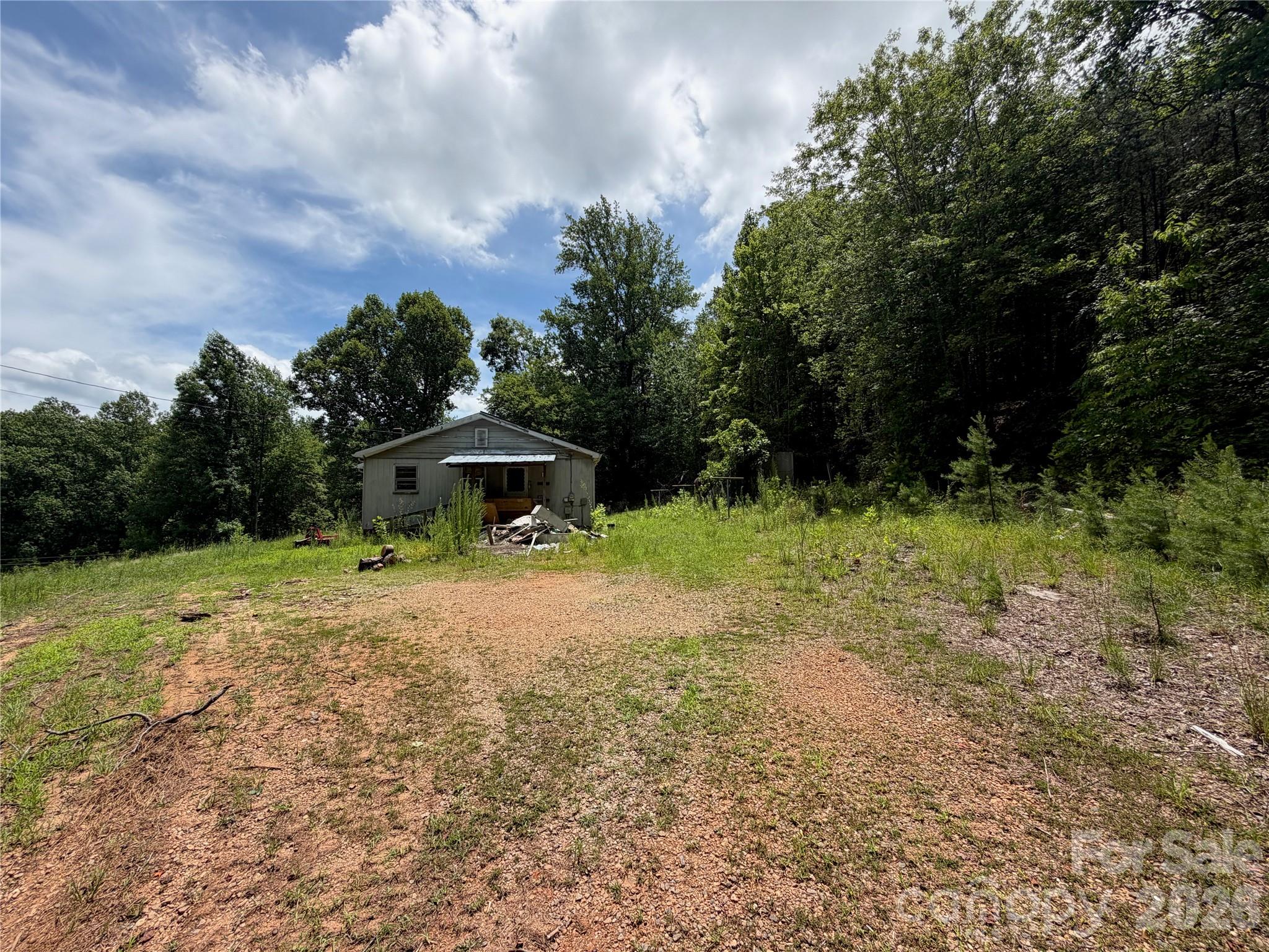 INVESTOR SPECIAL!! 1500+ sq ft, 3-4 bedroom fixer upper on 5.9 acres! Fix & flip, Fix & Live, Fix & rent, subdivide & build, etc – all potential options with this property. The land offers plenty of room for further/additional development. Most of the property was once pasture land, and now has younger pine trees that can be cleared much more easily than hardwoods. The home itself has been partially gutted and is ready for your creative touch to reclaim it with a modern finish! Spacious layout will offer comfortable living space once complete. Act fast and take advantage of this wonderful opportunity!