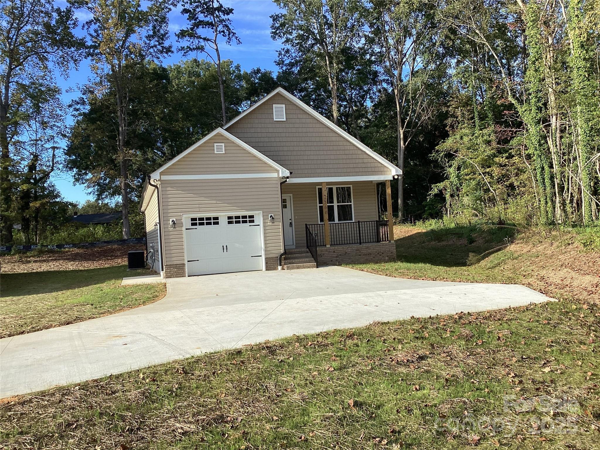 This brand new 3 bedroom/2 bath house is conveniently located within walking distance of numerous popular businesses and restaurants in Salisbury.  Once inside, an open living room and eat-in kitchen greet you, with vaulted ceilings making the space feel larger. A spacious walk-in pantry provides plenty of storage space and is located near the kitchen for quick and easy access. Granite countertops and custom cabinets adorn the kitchen as well as stainless appliances. Retreat to the master bedroom, which overlooks the rear porch and includes a step ceiling, adding a visual aesthetic overhead. The 4-fixture en-suite includes a walk-in closet behind a pocket door. Bedrooms 2 and 3 are identical in size and sit across from the master . The one car garage faces forward on this home and opens into a mud room as it enters the house. The concrete driveway, with ample parking, accesses the garage.