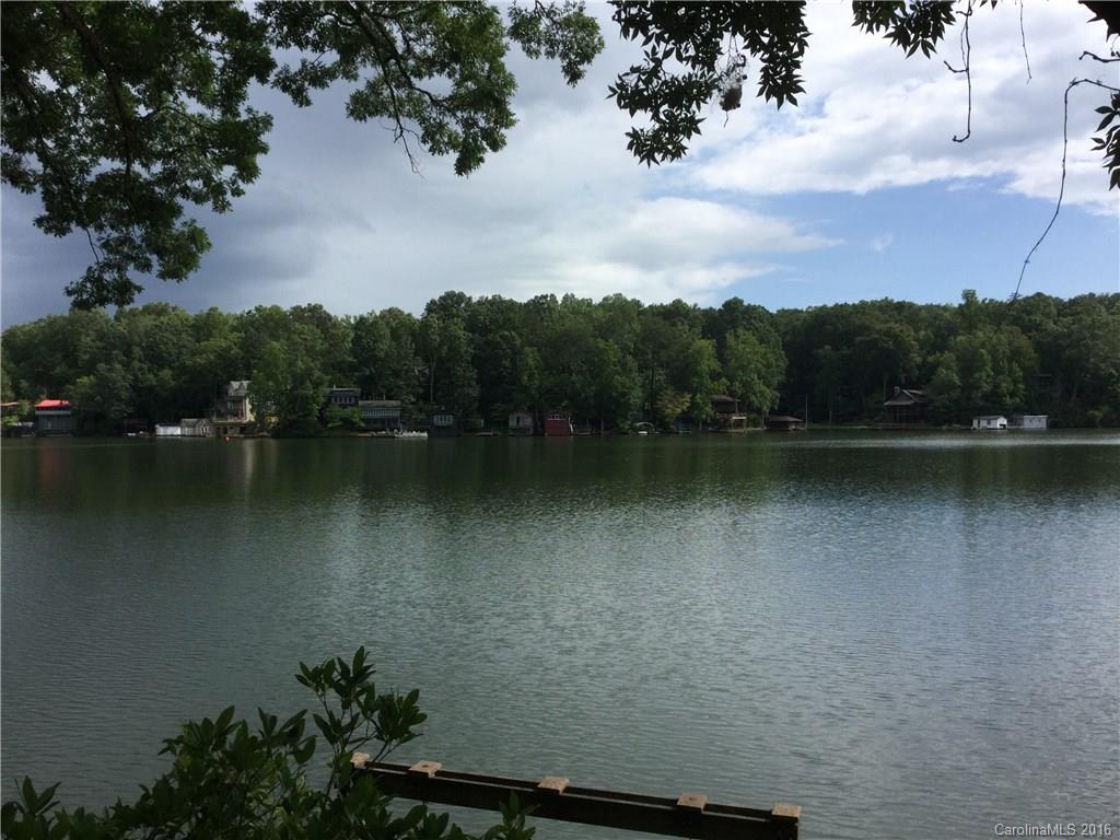 One of the few remaining lots with boathouse on the first basin of Lake Lanier, South Carolina. Just over two miles from downtown Tryon, North Carolina. Northern lake view across to dam. Cabin and boathouse of no value.  Sold as is.