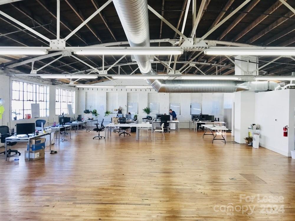 Unique 2nd floor office space available in downtown Asheville's South Slope district. The newly renovated space has private entrances, high ceilings, new HVAC, hardwood floors, exposed brick and natural light. The open floor plan includes new ADA accessible restrooms and a kitchenette area. Ample on-site parking. Ideal location and layout for creative or co-working office. Highlights: South Slope Location; Off-Street Parking; Office, kitchenette, restrooms; HVAC; High ceilings, hardwood floors, exposed brick, big windows