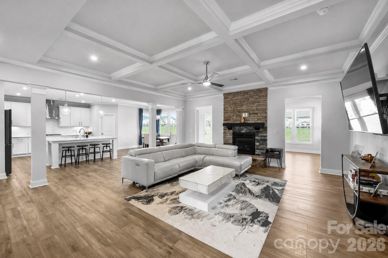 The right floor plan can change the way you live.

Some homes are measured by their square footage. The best ones are remembered for the way they live. Built in 2023, this thoughtfully designed five-bedroom, 4.5-bath home blends open gathering spaces with the private retreats today's lifestyles demand. Whether you're working from home, welcoming overnight guests, accommodating multigenerational living, or simply wanting room to spread out, every space has been designed with purpose.

A dramatic two-story foyer sets the tone, leading into bright, open living spaces highlighted by coffered ceilings, quality trim work, and a raised-hearth fireplace. At the heart of the home, the kitchen naturally brings everyone together, featuring a large conversation island, quartz countertops, a gas cooktop, double wall ovens, a generous walk-in pantry, and abundant cabinetry. A butler's pantry creates a seamless transition to the formal dining room, while the breakfast area is surrounded by large windows that fill the space with natural light. The oversized sunroom extends the living area, creating another inviting place to relax, gather, or simply enjoy the day.

The floor plan continues to impress with a private office featuring French doors, a main-level guest suite with an ensuite bath, generously sized secondary bedrooms, an expansive bonus room, and the everyday convenience of an upper-level laundry room. Upstairs, the primary suite is a true retreat with elevated ceilings, a comfortable sitting area, three walk-in closets, and a crisp white spa-inspired bath designed to begin and end each day in comfort.

Situated on a generous homesite in Ashe Meadows, this home combines the advantages of newer construction with low HOA dues and convenient access to I-485, shopping, dining, and everyday conveniences. Just minutes from Olde Sycamore Golf Club, it also offers easy access to one of the area's premier golf destinations.

If you've been comparing homes throughout Indian Trail and western Union County, you'll quickly discover the difference isn't simply what this home offers—it's how effortlessly it lives. Thoughtfully designed, beautifully finished, and ready to adapt to every stage of life, this is a home that will continue to reward you long after moving day.