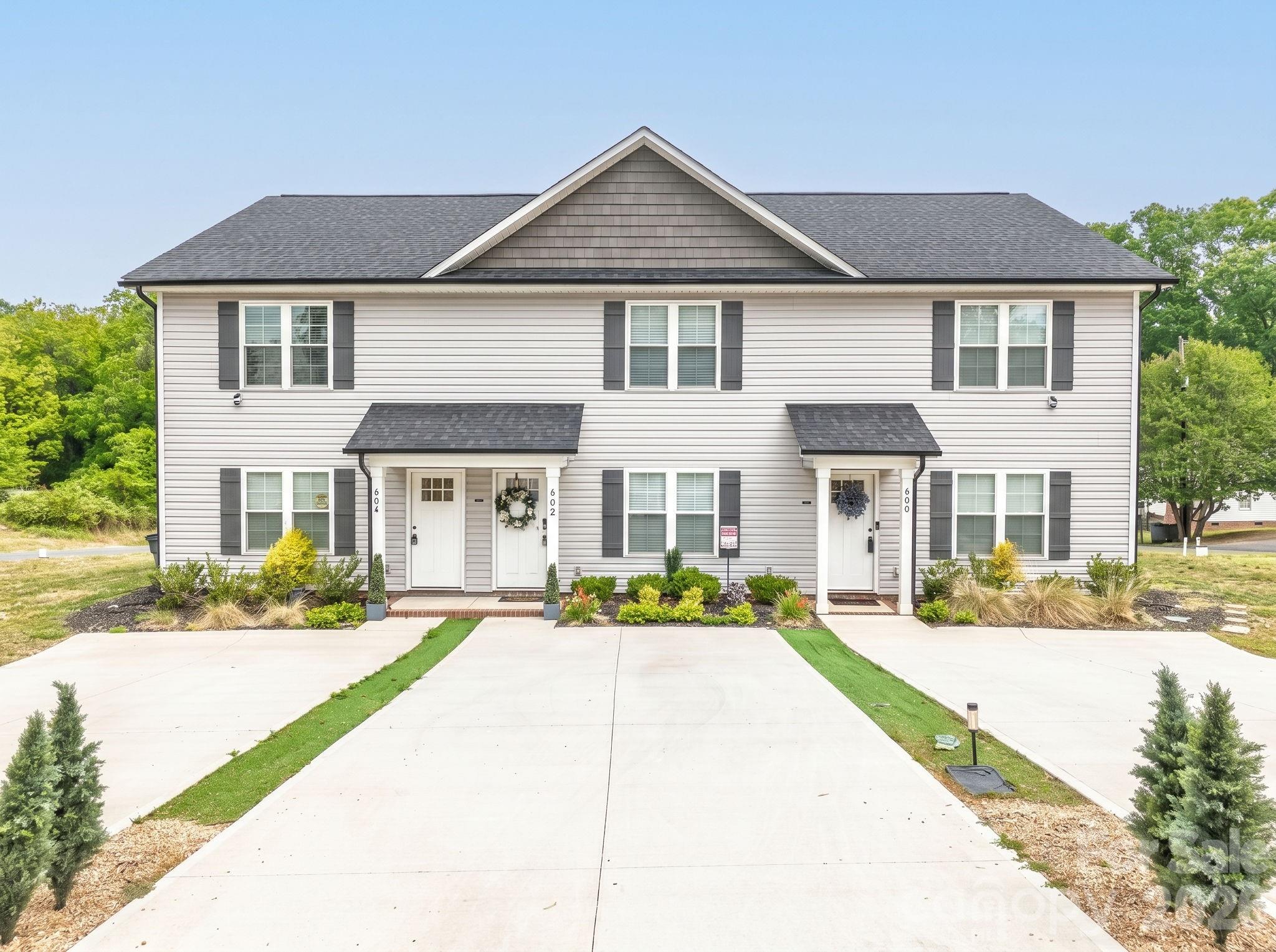 Discover modern 3-bedroom, 2.5-bath townhomes just minutes from downtown Kannapolis. Available for purchase individually or as a package of all three units, this is a flexible opportunity for both homeowners and investors. This individual townhome sits on the far right, making it an end-unit. Ideally situated near Atrium Health Ballpark and the revitalized downtown area, you’ll have convenient access to popular dining, shopping, and entertainment. Enjoy nearby outdoor recreation with the 8th Street Greenway and Bakers Creek Greenway, connecting to a scenic 2-mile loop from Bakers Creek Park to Village Park. Each two-story townhome offers approximately 1,260 square feet of well-designed living space, featuring a covered front porch, granite countertops, stainless steel appliances, shaker-style soft-close cabinetry, vaulted ceilings, ceiling fans, and generous storage. With stylish finishes and move-in ready condition, these homes present an excellent opportunity in one of Kannapolis’s growing areas. Schedule your showing today!