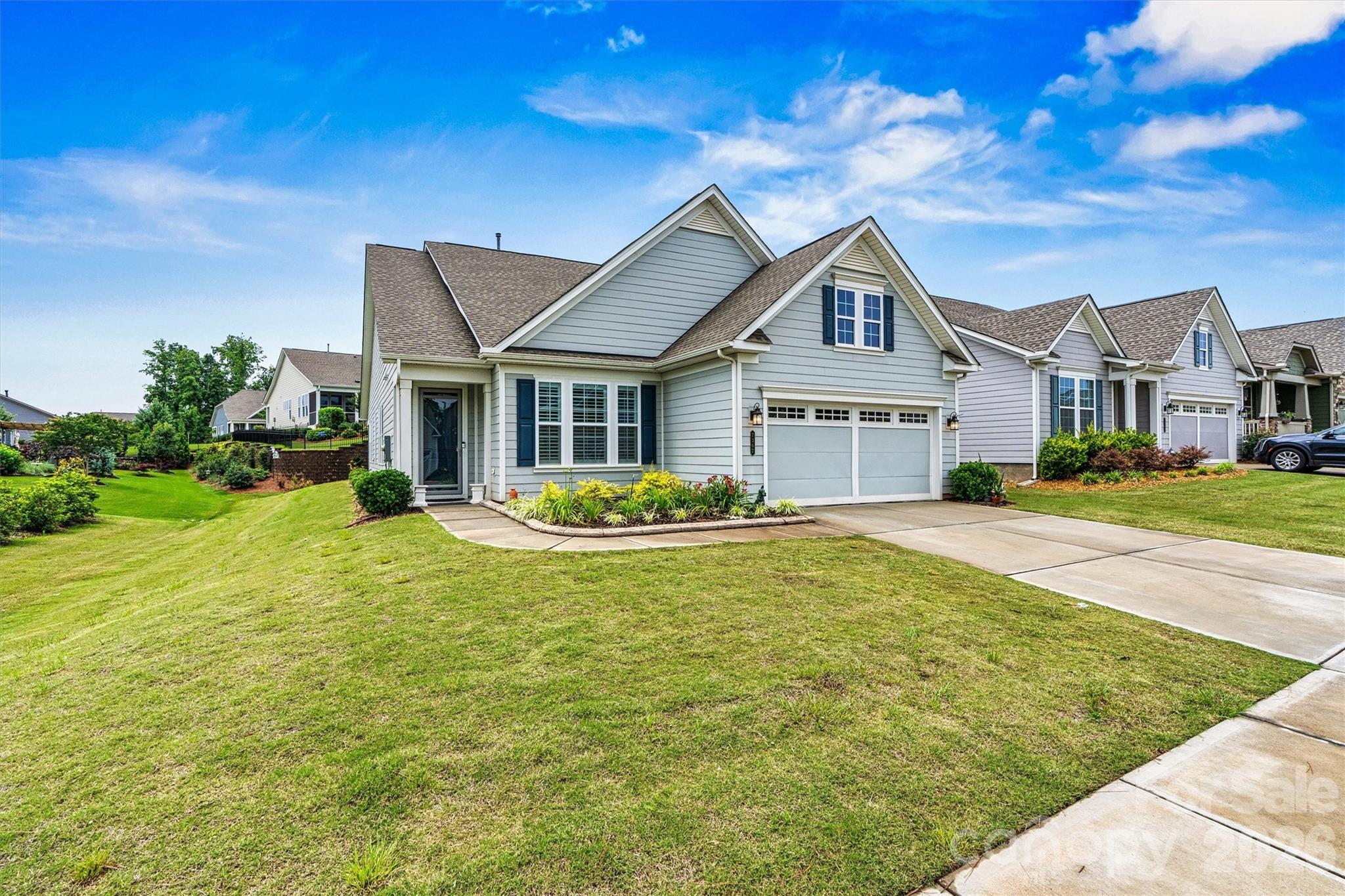 Just a short stroll to the clubhouse, resort-style pools, and endless community activities, this beautifully upgraded DOGWOOD with Loft offers the perfect blend of comfort, style, and convenience! Featuring 3 Bedrooms, 3 Baths, a Study/Office and spacious Loft with Full Bath, this bright open floorplan showcases LVP flooring, plantation shutters, recessed lighting, and exceptional storage throughout. The upgraded Kitchen boasts soft-close cabinetry, custom pantry, farmhouse sink, and abundant prep space. Relax in the serene Primary Suite with tray ceiling, custom closet, dual vanities, and spa-inspired shower with seat and grab bar. Outdoor living is a dream with an extended Sunroom, Screened Porch, Covered Porch, and paver patio with lighted knee wall plus gas stub for a firepit or grill. Additional highlights include epoxy garage floor, overhead storage, and a Laundry Room with cabinetry and built-in sink. Move-in ready and beautifully appointed, this exceptional home is ready for your next chapter!