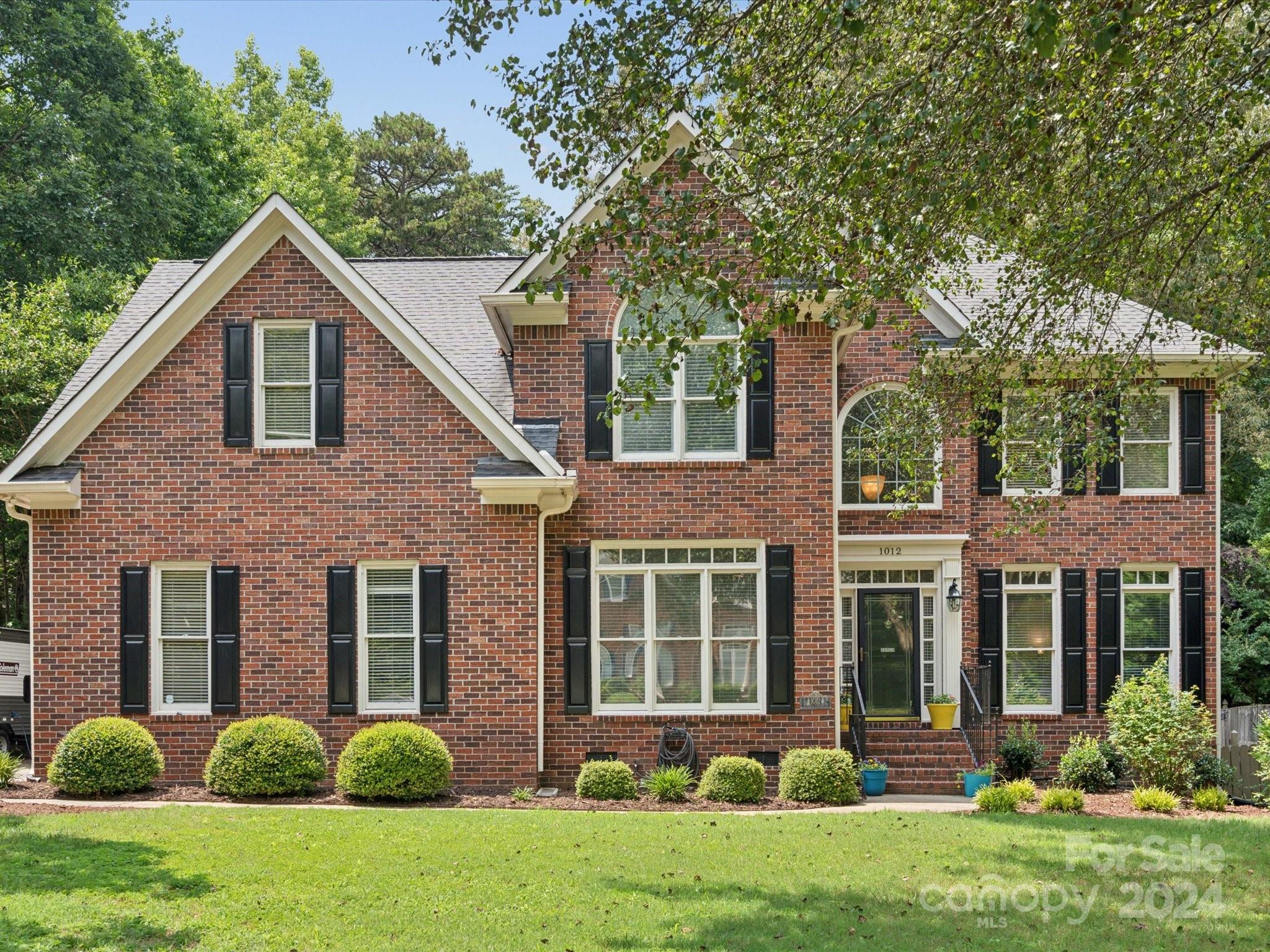 This Providence Hills home offers a serene half-acre, fenced lot lined with trees and a rear storage shed. The kitchen features stone backsplash, a center island with gas cooktop, Silestone quartz countertops, double oven (convection upper) and new dishwasher (2024). The two-story great room has a floor-to-ceiling gas fireplace, large windows and built-in bookcases. Enjoy the bright, tiled sunroom overlooking the in-ground saltwater pool with a new pump and filter, an oversized multi-level deck, fire pit area, archway, market lights and fully bloomed planters. The main level includes a home office/5th bedroom. Upstairs, the primary suite features a versatile extra room and a luxury bath with a jetted tub, double vanities, and an electric fireplace. Includes a new water heater and HVAC/Furnace (2023). Conveniently located in the charming town of Matthews, Union county schools and a tons of recreational activities at the clubhouse and pool.