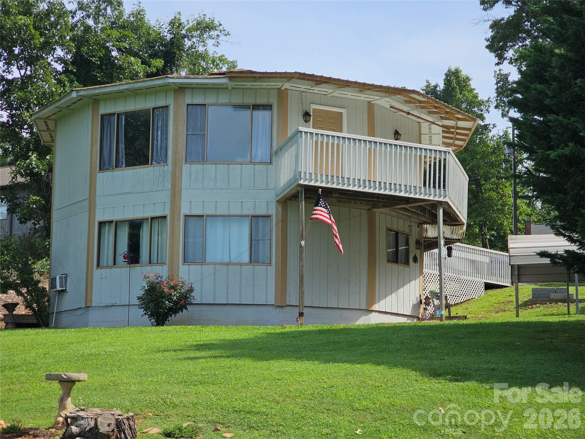 Charming DUPLEX with Year-Round Lake Views
Discover this beautifully crafted Deltec home offering year-round views of Lake Hickory. This two-level retreat features on each level 2 spacious bedrooms, a full bathroom, and an open-concept kitchen and living area that’s perfect for both everyday living and entertaining. Natural light floods the interior, highlighting the warmth and character of the home’s unique design.
Located just a short walk from Lake Hickory Marina and Wittenburg boat access, this property is ideal for lake lovers and outdoor enthusiasts. Whether you're enjoying your morning coffee with a view or heading out for a day on the water, this home offers the perfect blend of comfort, convenience, and natural beauty.