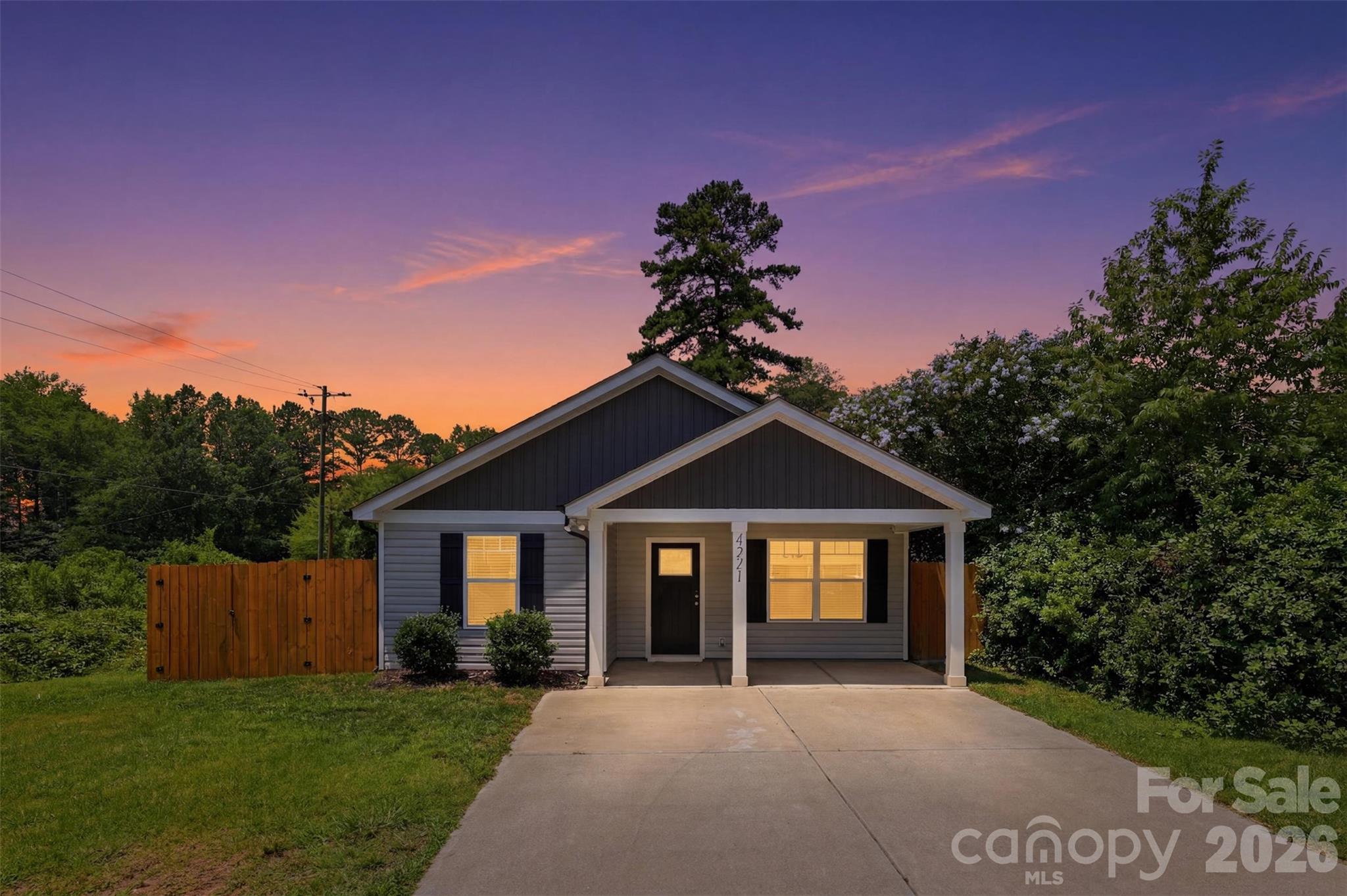 Welcome to this good-as-new ranch-style home in Charlotte, NC, where eligible buyers can take advantage of 100% financing and up to $15,000 in closing cost assistance. Offering the perfect blend of privacy, convenience, and easy main-level living, this 3-bedroom, 2-bath ranch is tucked away at the end of a quiet street and backs up to peaceful woods, giving it a secluded, private feel while still being less than 15 minutes from everything Charlotte has to offer. Step inside to a bright, functional floor plan designed for everyday comfort, with open living spaces, modern finishes, and the feel of new construction without the wait. The ranch layout offers true main-level living, making it a great option for first-time homebuyers, move-down buyers, investors, or anyone looking for a low-maintenance home close to Uptown Charlotte. Outside, enjoy a fully fenced-in backyard with wooded views, giving you the privacy and outdoor space that is hard to find this close to the city. The backyard also includes a storage shed, perfect for lawn equipment, tools, bikes, or extra storage. Located close to shopping, dining, bars, restaurants, Charlotte Douglas International Airport, the U.S. National Whitewater Center, and major Charlotte attractions, this home offers the best of both worlds: a quiet, tucked-away setting with quick access to city convenience. If you have been searching for a move-in ready ranch home in Charlotte, a first-time homebuyer-friendly property, or a private home close to Uptown, the airport, and outdoor recreation, this one checks all the boxes.
