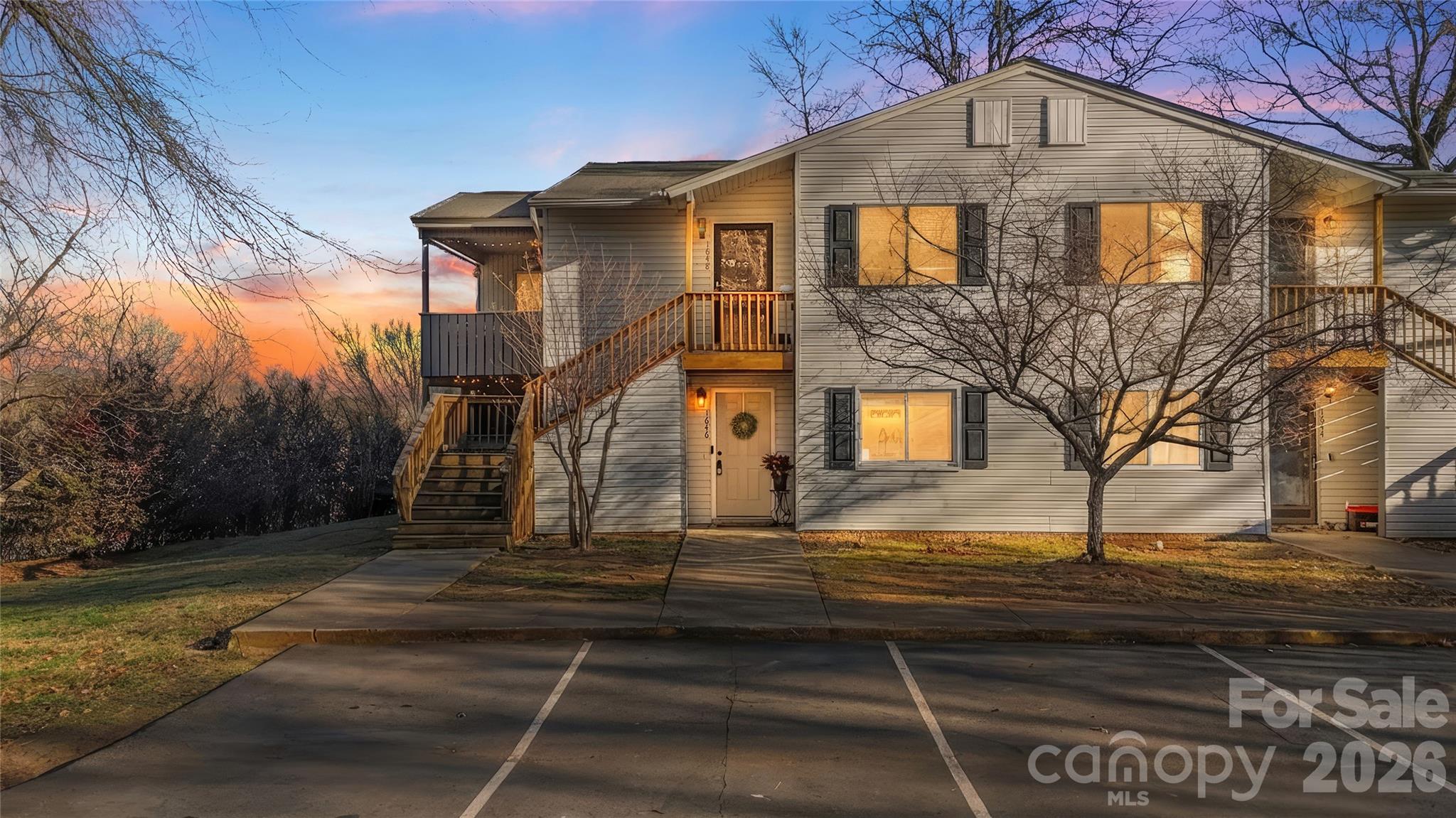 Charming main level condo offering 2 bedrooms and 1 bathroom with a bright, open floor plan designed for comfortable and convenient living! The durable vinyl plank flooring flows throughout the entire interior, while large windows fill the home with natural light. The central living room connects to both the screened porch and also to the well-appointed kitchen featuring abundant cabinetry, stainless steel appliances, ample butcher-block counterspace, and a breakfast/dining area—perfect for everyday use and entertaining. The primary bedroom offers a cozy retreat and the secondary bedroom can make a great flex space if needed. This thoughtfully laid-out condo blends style, functionality, and easy living in a convenient single-level design. Great location with shopping, entertainment and restaurants near-by as well as easy access to I-77
