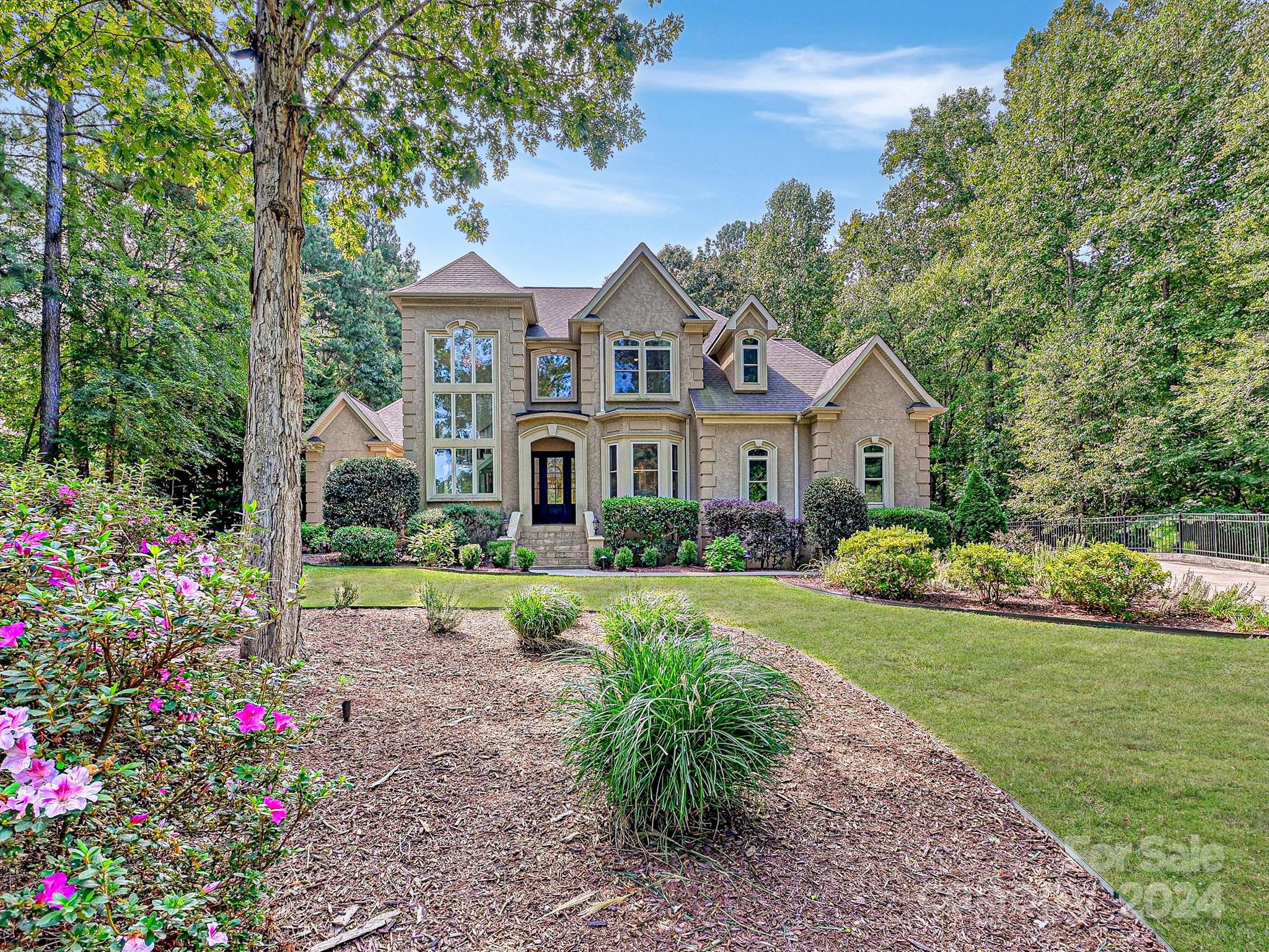 Trinity Ridge introduces its latest gem: a stately home of grace and tranquility. Spread over two acres, this property has been designed to capture the beauty of its surroundings, offering a peaceful and elegant retreat. At its heart, the home is a testament to architectural excellence and thoughtful design, blending indoor comfort with outdoor allure. Highlights include a 2023 renovated kitchen and great room, a two-story screened porch for an immersive outdoor experience, and an array of custom features for those with a keen eye for detail and craftsmanship. The home features a spacious gourmet kitchen, perfect for family gatherings, and master and in-law suites on the 1st floor for ultimate comfort and accessibility. A patio with motorized screens, a 2023 renovated primary bathroom, dual soundproof offices, custom-built ins, a fireplace with ship-lap accents, refinished hardwood floors, new carpeting, a state-of-the-art HVAC system, and an encapsulated crawlspace add to its allure.