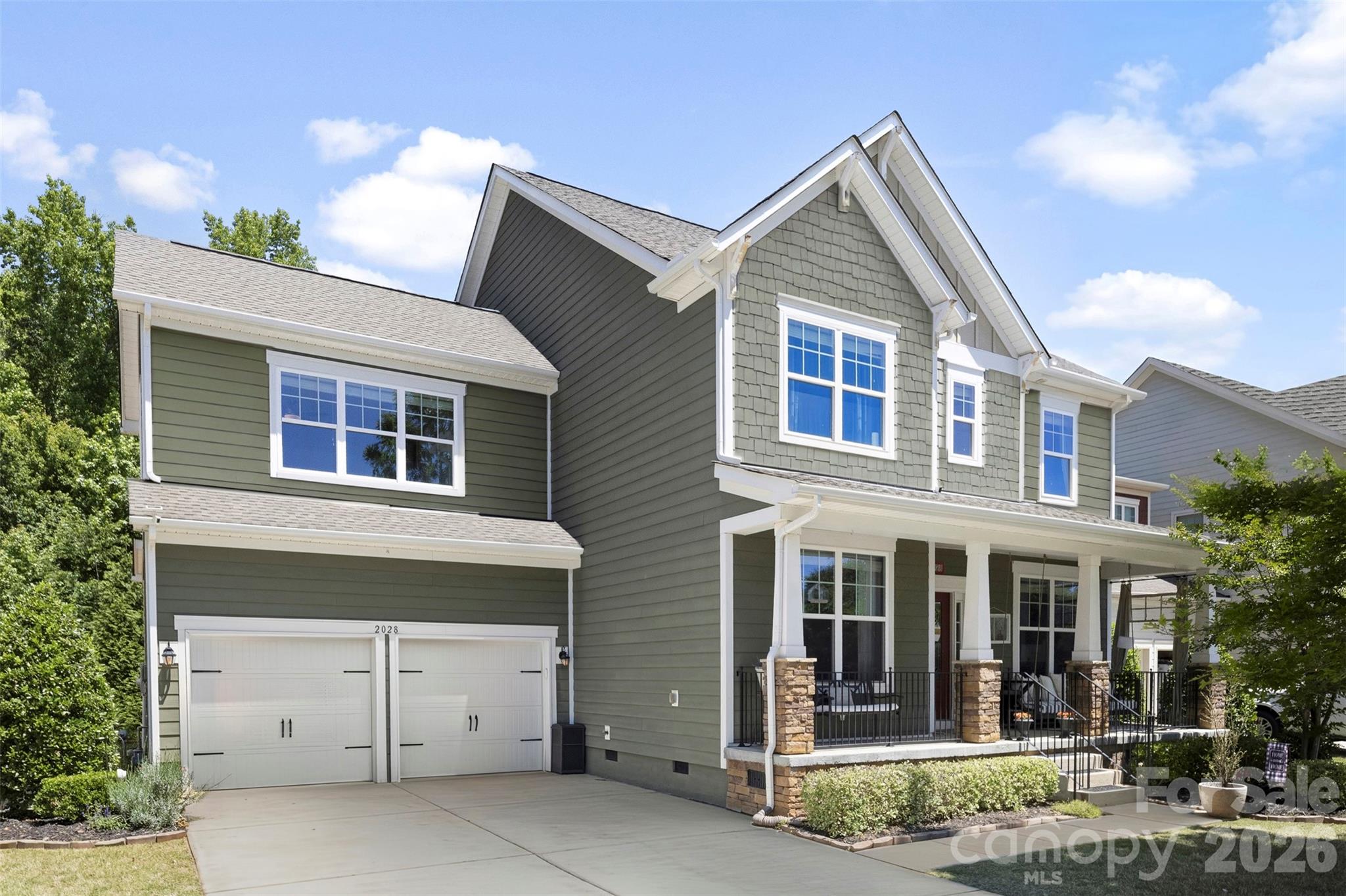 Welcome to the lifestyle — and the home — that rarely becomes available. Located in one of Lake Wylie’s most sought-after resort-style communities, Handsmill on Lake Wylie, and zoned for the highly acclaimed Clover School District, this exceptional 5-bedroom, 3.5-bath residence offers the perfect blend of luxury, comfort, and functionality.

From the inviting front porch to the expansive screened-in back porch, every space is designed for both everyday living and effortless entertaining. The rare flat backyard, framed by a private wooded backdrop, creates a peaceful outdoor retreat complete with a paver patio, firepit, and swing — ideal for relaxing evenings and gatherings year-round.

Inside, the thoughtfully designed main level features multiple flex spaces perfect for a home office, formal dining room, playroom, or additional living area. The open-concept floor plan seamlessly connects the kitchen, breakfast area, and great room, creating a bright and welcoming heart of the home. Convenient drop zone located just off the attached two-car garage, offering the perfect everyday landing space for organization and storage.

Upstairs, you’ll find an incredibly versatile layout with a spacious secondary suite featuring a private ensuite bath with dual sinks, walk-in closet, and shower — making it an ideal guest suite, bonus room, or second primary option. Three additional bedrooms share a well-appointed bath with dual sinks and a private tub/shower area. Conveniently located upstairs laundry room with ample space, thoughtfully positioned near the bedrooms for everyday ease and functionality.

The private primary suite is a true retreat, showcasing tray ceilings, abundant natural light, a spacious walk-in closet, and a luxurious bath complete with dual vanities, garden tub, and separate shower. Additional peace of mind comes with a new HVAC system installed in 2026 along with a transferable warranty.

Perfectly positioned directly across from a charming community common area in the highly sought after Pinnacle section, this home enjoys added open space, sidewalks, cul-de-sacs, and street lights right outside your door — creating the ideal neighborhood feel.

Residents enjoy resort-style amenities including a pool, clubhouse, fitness center, playground, walking trails, and lake access all within a gated community. Conveniently located near the new elementary and high schools, future Harris Teeter, shopping, dining, and just minutes from Charlotte, this home also benefits from low county taxes and the highly desirable Clover schools.

Offering an exceptional combination of space, location, amenities, and lifestyle, this is truly the unicorn you’ve been waiting for.