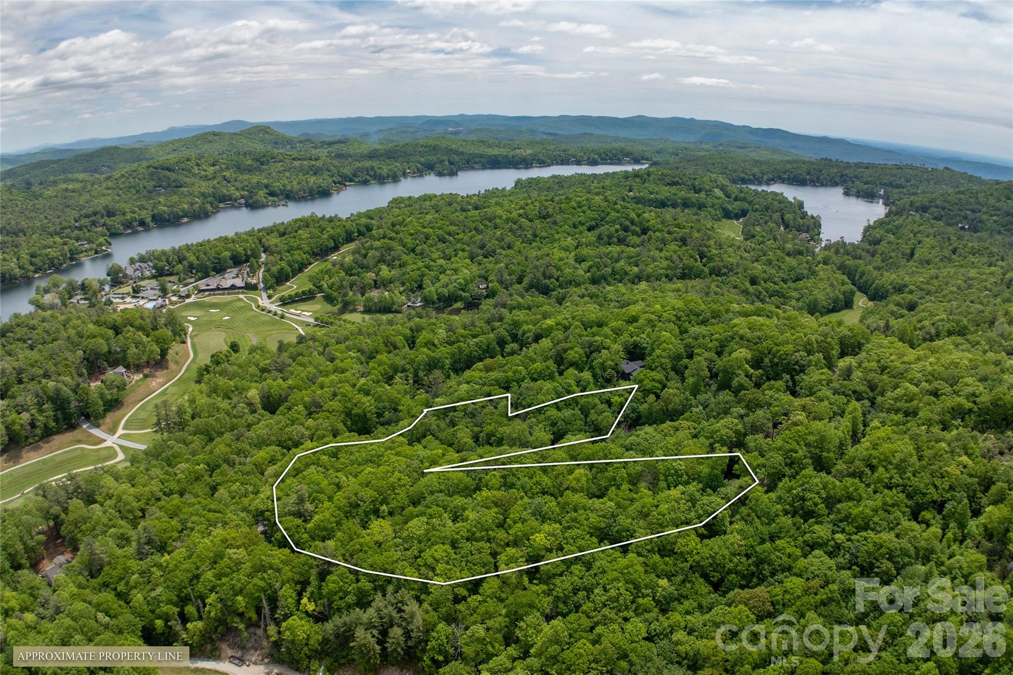 This Toxaway Mountain oasis offers 2 lots that have been combined into 5 plus acres of beautiful mountain land in the prestigious Lake Toxaway Estates community. Ideally located at the base of Toxaway Mountain and just minutes from the club and community amenities, this private homesite features natural hardwoods, native rhododendron, and the potential for stunning mountain views with selective clearing. Enjoy the perfect combination of privacy, natural beauty, and convenient access to the exceptional lifestyle Lake Toxaway Estates has to offer. Membership to Lake Toxaway Country Club is based on availability and application.