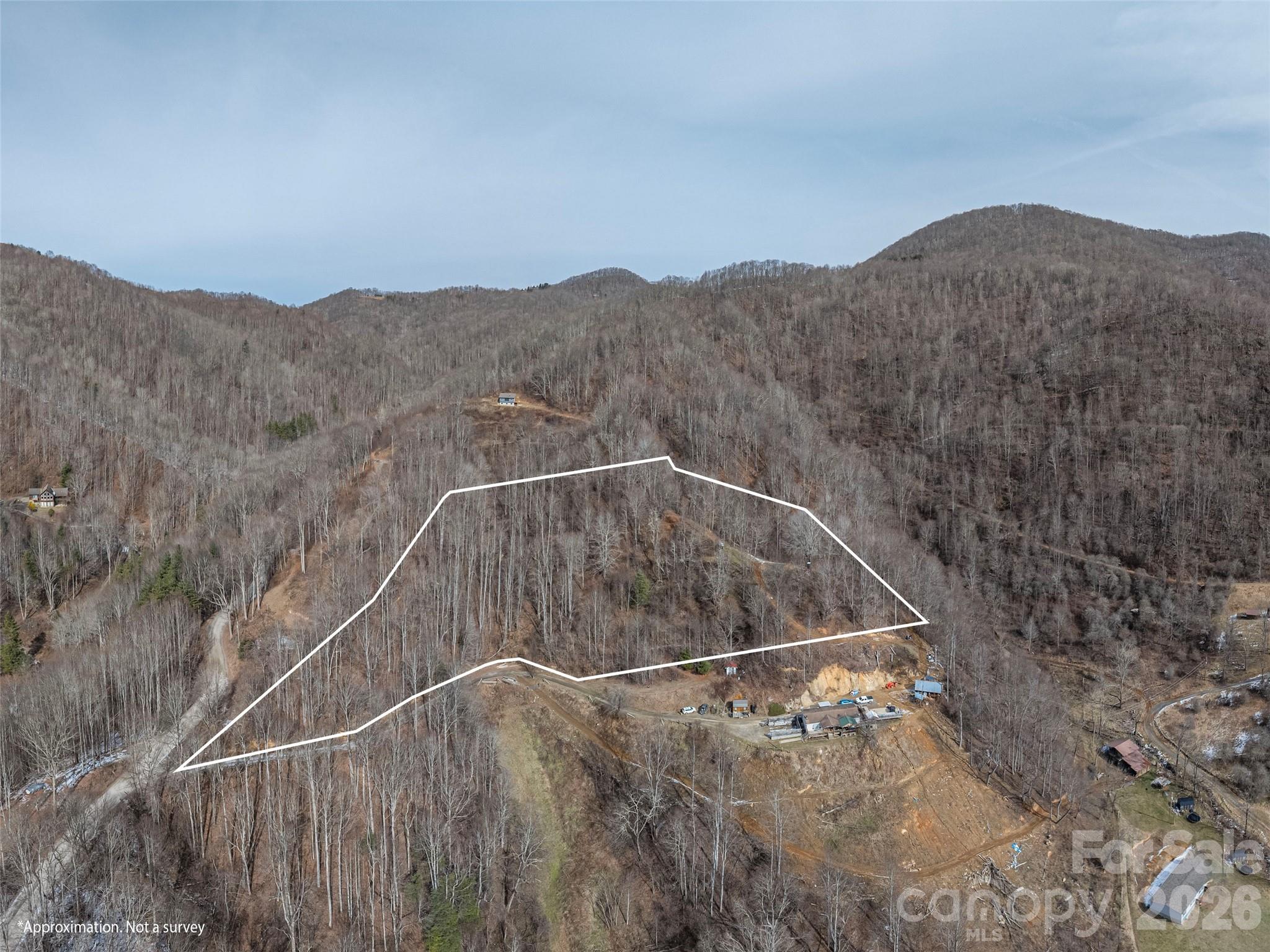 Perched on its own peak, this property showcases sweeping mountain views that stretch for miles across the county. The land offers a rare combination of privacy, natural beauty, and serenity—everything you could want in a true mountain escape. This tract can be purchased alone or combined with two adjoining parcels for over 17 acres. Whether you envision a private estate, family retreat, or cozy cabin getaway, this property provides the perfect setting to enjoy the peace of nature. With selective tree trimming, year-round views are easily attainable.
