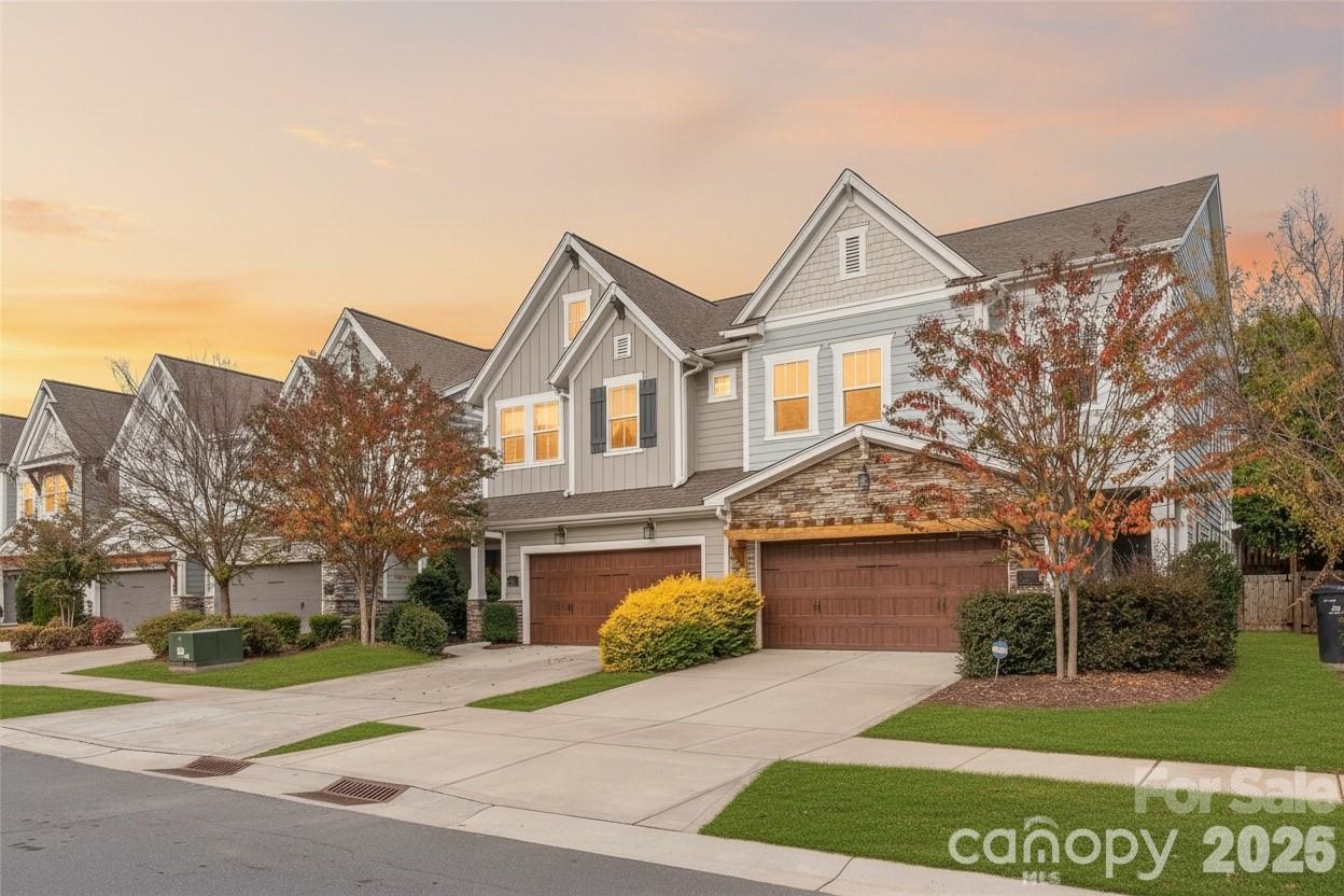 Welcome to this luxury townhome by David Weekley in the heart of Sedgefield—one of Charlotte’s most desirable and walkable communities. This rare find features a main-level Owner’s Suite with a vaulted ceiling, spa-inspired bath, and expansive custom walk-in closet. The open-concept chef’s kitchen impresses with soft-close cabinetry, stainless steel appliances, a 5-burner gas cooktop, subway tile backsplash, and a large center island with designer lighting; perfect for entertaining. Enjoy 10’ ceilings and beautiful hardwoods throughout the main floor, along with a covered patio ideal for relaxing or grilling out. Upstairs offers a spacious loft/rec room for movie nights or game time, three generously sized bedrooms, and two full baths; including a private guest suite. Natural light fills every corner through oversized windows, creating an airy, modern feel. Additional highlights include a fenced private backyard and epoxy-finished 2-car garage. Located in the highly sought-after Sedgefield community, you’ll love being moments from South End, Dilworth, and Park Road...plus just a short walk to the Blue Line for easy Uptown access.