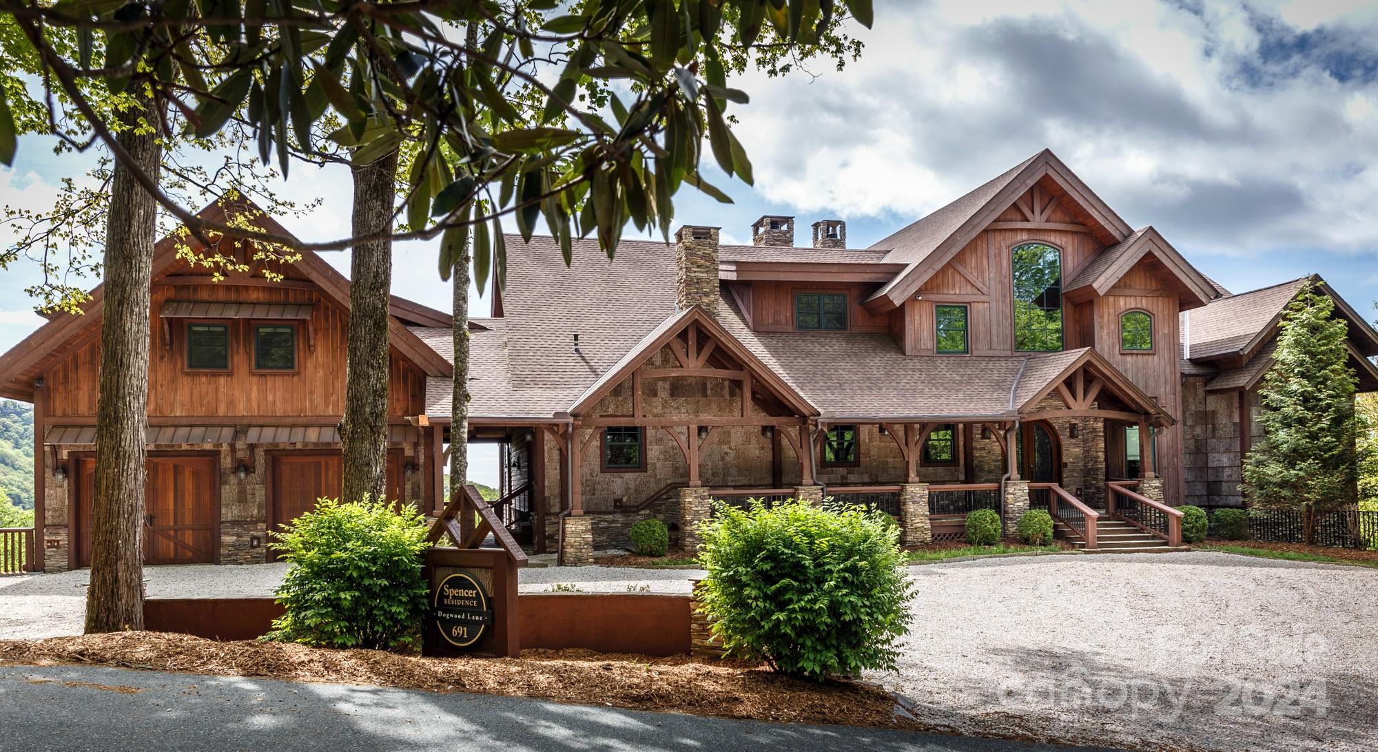 Situated in one of Blowing Rock’s premier neighborhoods, this stunning combination of mountain luxury, style, convenience, & extraordinary outdoor living is designed around the breathtaking John’s River Gorge & Blue Ridge Mountain views! Great for year-round living or vacationing! This timber-frame masterpiece includes a 4BR 3.5BA, 7,000+ SF main home & 700+ SF above-garage apartment (w/ full kitchen, full bath, separate flex room, laundry hookups, & gorge views). Cathedral ceilings anchored by impressive timbers & a massive stone fireplace are highlights of the great room & a chef’s kitchen opens up to an eat-in bar w/ a fireplace, formal dining, loft, & laundry/mud room. The primary suite is spacious & private & features a stone fireplace, 2 walk-in closets & a spa-like bath. The lower floor holds a 2nd living space w/ a fireplace & wet bar, wine cellar, theater room, exercise room, & 3 bedrooms. The main level deck/stone patio features an outdoor grilling kitchen & stone fireplace!