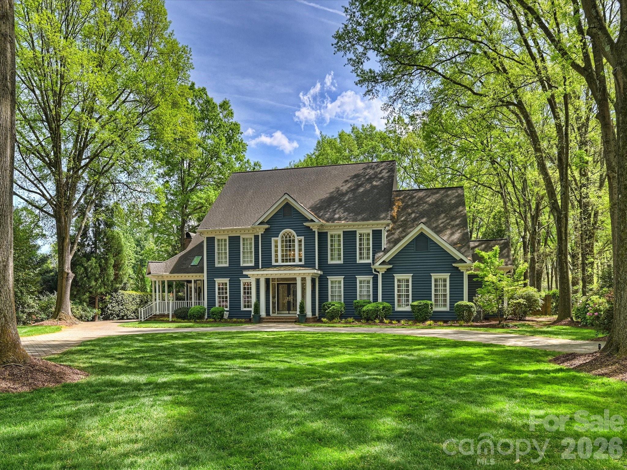 Welcome to 8226 Fairview Road — an elegant estate set on 1.5 acres in the heart of SouthPark. Tucked behind a charming brick wall, this distinctive home offers timeless architecture, privacy, and an open floor plan for modern living. A circular driveway, gas lanterns, lush landscaping, and covered side porch create a striking first impression. Inside, a curved staircase leads to a two-story living room anchored by a stunning stone fireplace. With six fireplaces throughout, the home offers warmth and character across multiple entertaining spaces.
The updated kitchen opens to a cozy keeping room, while the sunroom overlooks the private backyard and resort-style pool. Flexible living areas include a large bonus room with bar and full bath, dedicated office space, and a large third floor with private bedroom, bath, and office.
The main-level primary suite features serene pool views, large walk-in custom closets, and a spacious bath. The outdoor living space is great for entertaining. Features include a pool, spa, outdoor fireplace, grilling area, and expansive backyard.
This 6 bedroom home offers 5 full and 3 half baths and is ideally located just minutes from SouthPark’s premier shopping, dining, and conveniences. Zoned for top-rated Charlotte-Mecklenburg schools.