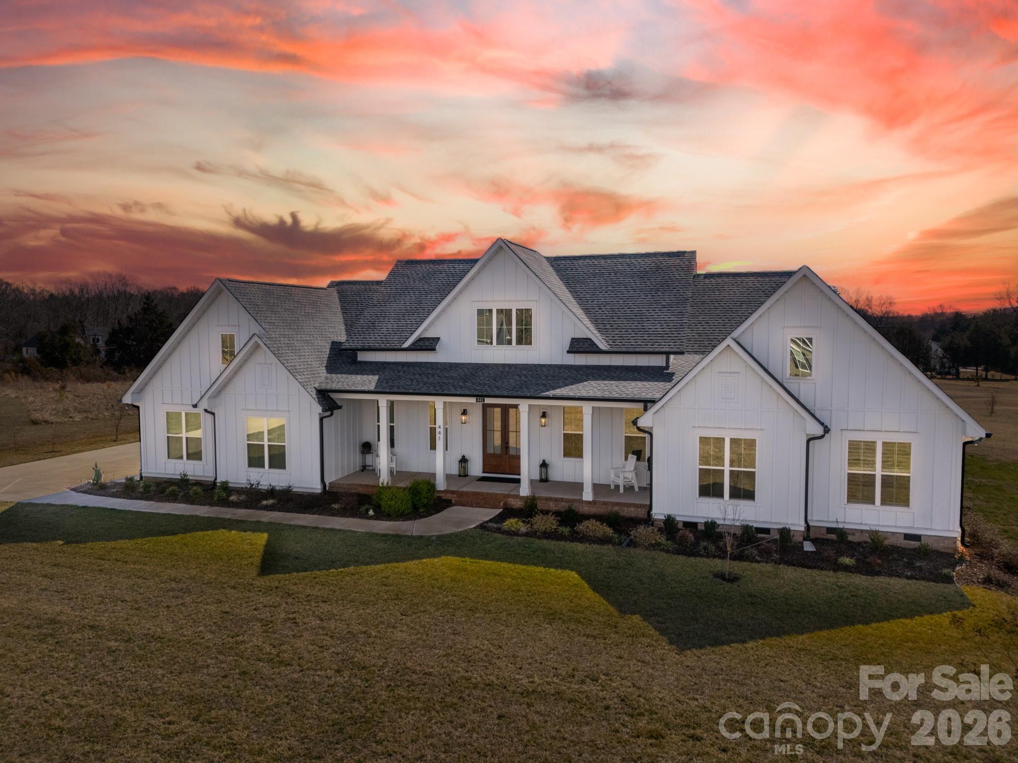 Better than new and thoughtfully designed, this stunning 2024 custom home by Waddell Custom Homes offers the perfect blend of luxury, comfort, and functionality on 1.06 acres in desirable Clover. Every detail has been carefully curated for modern living. The open, light-filled floor plan creates effortless flow, anchored by a chef’s kitchen with an oversized island that opens seamlessly to the great room—ideal for entertaining and everyday life. Spacious bedrooms provide a peaceful retreat, while the expansive outdoor living area invites relaxation or hosting under the Carolina sky. Enjoy premium upgrades you won’t find in new construction, including a whole-house Generac generator, irrigation system, motorized retractable screens, patio awning, swim spa, and a walk-in pantry with wine bar. A 3-car garage and enhanced indoor-outdoor living make this exceptional home truly move-in ready.