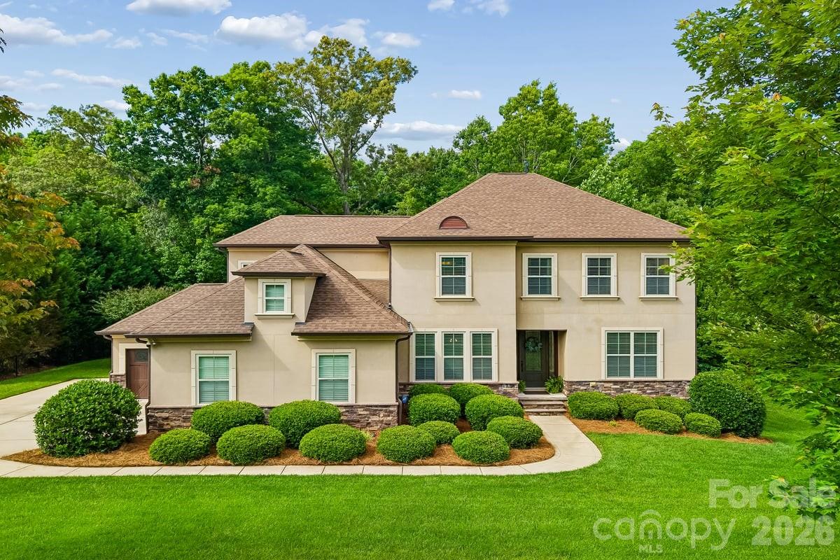 Gorgeous Weddington Trace Estates Home Nestled on a tranquil, wooded, and fully fenced 0.55-acre lot. This turn-key, open concept beauty is a private sanctuary designed to impress with style, every day comforts  & functionality. 

Step inside to discover  high ceilings, arched doorways, and hand-scraped hardwoods throughout most of main living areas. The heart of the home-a stunning gourmet kitchen with an expansive kitchen island, stainless steel appliances, gas range, under-cabinet lighting and a large walk-in pantry—all opening seamlessly into a lovely breakfast room & fabulous spacious great room anchored with a gas fireplace, inviting you to unwind or entertain. 

The main floor also boasts a luxurious primary suite designed as an ultimate escape. This retreat features an ensuite bath with a spa-like soaking tub, a oversized shower outfitted with a rain system & dual vanities complemented by his-and-her walk-in closets—offering unparalleled storage and organization. 

Beyond the primary suite, the main floor also boasts a formal dining room with coffered ceilings, a versatile office or additional bedroom with French doors, a well-appointed mudroom with a drop zone, and a large laundry room.

Upstairs, you’ll find three generously sized bedrooms, two full baths, a loft, and a bonus/media room ready for movie nights, gaming marathons or fitness -the choice is yours!

But the magic doesn’t stop indoors. Step out onto the screened porch with skylights that feels like a private treehouse, overlooking a lush, secluded backyard. Entertain guests on the beautiful paver patio, complete with a gas hookup for your grill. 

Additional features: Outdoor landscape lighting, full yard irrigation, 3-car garage with an extended driveway, a tankless water heater, Newer HVAC/2022 with warranty, 6-inch gutters, and endless storage space throughout. 

Amenity rich community:  enjoy a Clubhouse, Jr. Olympic Pool with Splash Pool, Tennis & Pickle Ball Courts, Game Courts, Scenic Walking Trails, Stocked Pond with Dock for Fishing. 

Your dream home awaits—don’t miss the opportunity to make this one yours!