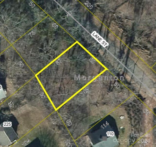 Nestled in the picturesque town of Morganton, this lot would be perfect for a tiny house or a smaller starter home.  With city sewer and water conveniently available, you can focus on crafting your ideal living space without worrying about the hassles of well and septic systems. Located behind Roses, this location puts you just minutes away from the heart of downtown Morganton, where a diverse array of shopping, dining, and entertainment options await. Indulge in the town's thriving culinary scene, savoring the flavors of locally-owned eateries and breweries that have garnered a loyal following. For a night out on the town, catch the latest blockbuster at the cinema or explore the unique boutiques that line the streets. Convenience is paramount with this property, as it boasts easy access to major thoroughfares like US-70 and I-40, ensuring a seamless commute to nearby cities or a swift escape for weekend adventures in the stunning Blue Ridge Mountains.