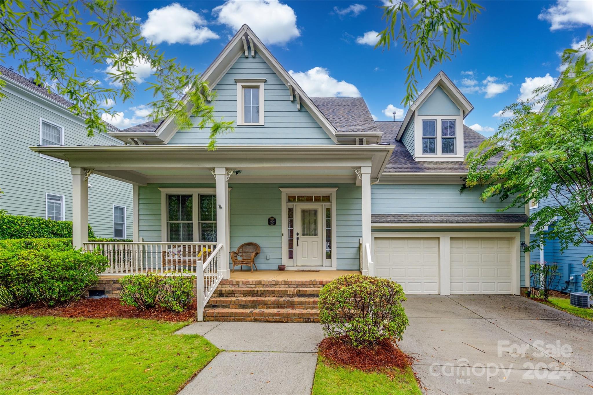 Welcome to your new home in the coveted Baxter Village!  As you walk through the front door, you'll fall in love with the openness & the view overlooking the large, private back yard.  This home backs to miles of wooded trails throughout Baxter!  The main level features the kitchen with huge island, family room open to the 2nd floor w/gas fireplace, primary bedroom/bathroom, main floor laundry, office w/French doors, and dining room.  Walk up the open stairway to 3 additional bedrooms, 2 full baths, walk-in attic spaces, and a loft great for a playroom, movies, exercise room, or whatever your family may need.  This home is in a prime location of Baxter on a private street with no thru traffic, zoned for award-winning Fort Mill schools.  Enjoy community pools, playgrounds, tennis courts, walking trails, and all that Baxter Village has to offer w/easy access to I-77!