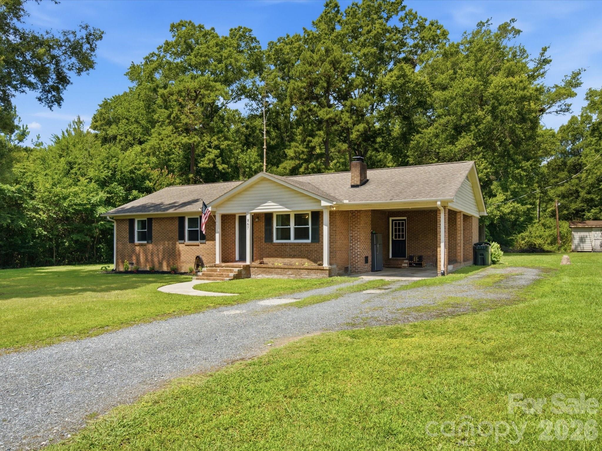 Beautifully renovated and move-in ready, this charming brick ranch is located on over half an acre in the
established Springdale neighborhood with no HOA. This 3-bedroom, 2-bath home features a bright, open concept layout with a beautifully updated kitchen that flows seamlessly into the spacious living room,
creating an ideal space for both everyday living and entertaining. A cozy wood-burning fireplace adds
warmth and character, while thoughtful updates throughout provide a fresh, modern feel. The large backyard
offers plenty of room to relax, play, garden, or host family and friends.

Conveniently located just minutes from shopping, dining, schools, parks, and I-77, this home combines
modern updates, a great location, and the freedom of no HOA, all in one inviting space!