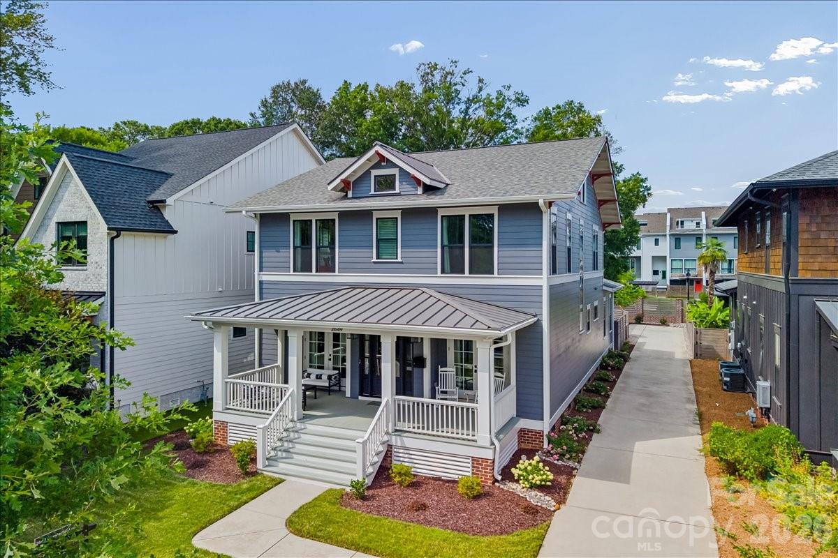 Stunning Craftsman in a great Chantilly location connected by a neighborhood path to the Chantilly Ecological Sanctuary which features 1.6 miles of walking trails and ponds plus all of the included amenities of Chantilly on The Green, which also include walking trails, green spaces, extensive landscaping, a fire pit, dog park, benches, and a gazebo with a grilling station. Inside, tradition meets modern convenience with an open floor plan with fantastic flow through the main living areas, site-finished hardwood floors, and soaring ceilings accented by rough-sawn box-beam rafters. The kitchen boasts a large island and ample counter space, accented by KitchenAid appliances and endless cabinetry storage. The first floor also features a full office and first-floor bedroom with an ensuite bathroom, along with a covered front porch and covered back patio, creating flexible living spaces for many buyers. Upstairs, the light-filled primary suite features dual walk-in closets and the perfect retreat of a bathroom with a soaking tub and dual vanities. On the upper level, you have two bedrooms with en-suite bathrooms and a huge laundry room. With a detached two-car garage and all-new exterior paint, this lightly lived-in, move-in-ready home creates a fantastic location within the neighborhood, plus the convenience of the growing Midwood and Elizabeth neighborhoods minutes away!