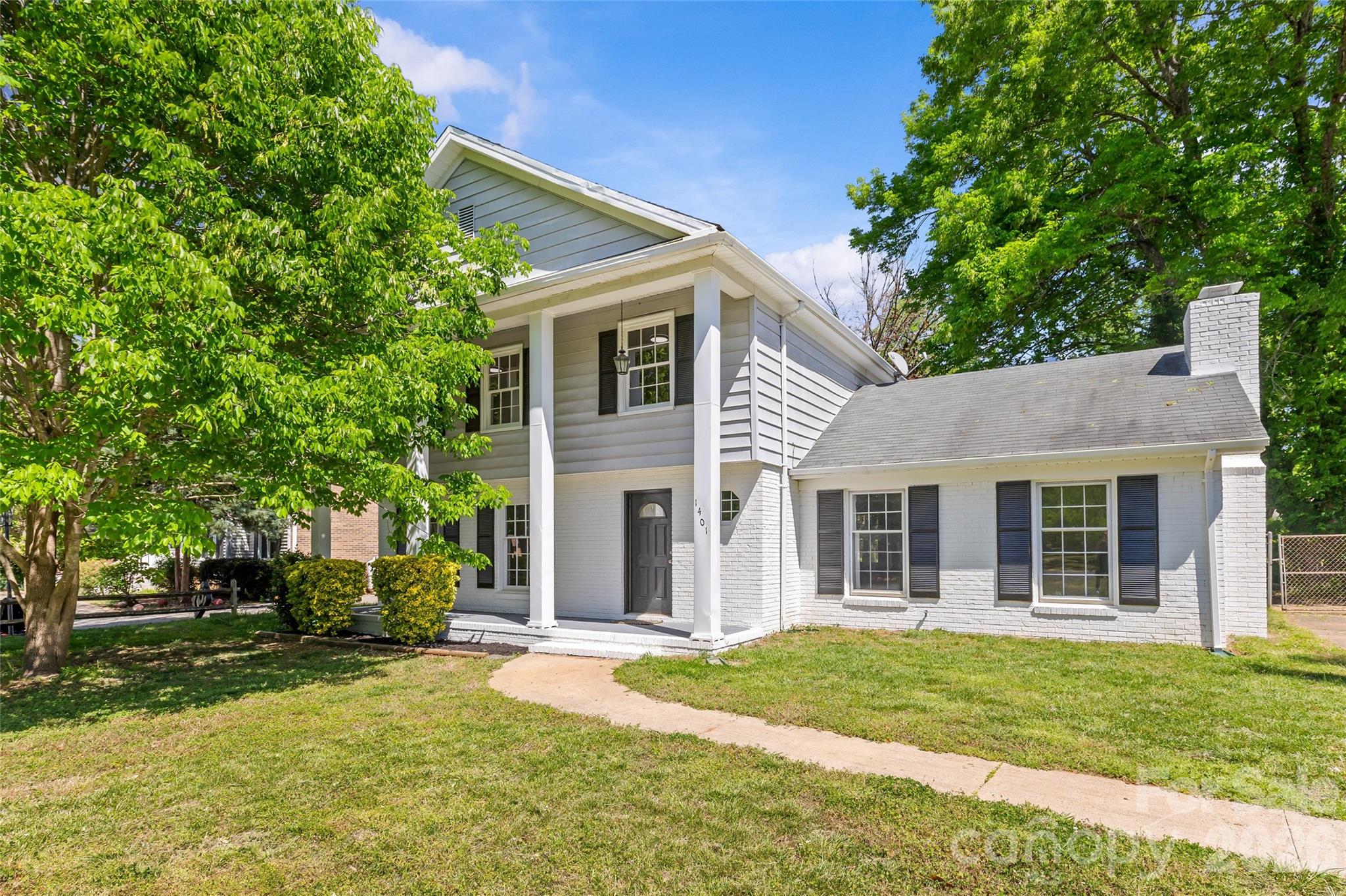 Recently refreshed Colonial Revival in sought-after Coventry Woods! Nestled on a spacious 0.25-acre lot shaded by mature trees, this home offers classic curb appeal highlighted by a welcoming front porch with striking two-story columns. Step inside to an inviting foyer and a thoughtfully designed floor plan. The formal living room, located just off the entry, is ideally suited for entertaining, while the dining room is ready to host gatherings of any size and flows effortlessly into the refreshed kitchen. New countertops, crisp white cabinetry, and stainless steel appliances create the perfect modern feel for the kitchen, which is truly the heart of the home. Just beyond, the spacious family room is centered around a cozy fireplace. Upstairs, the generous primary suite is a true retreat complete with a private ensuite bath. Three additional well-appointed bedrooms round out the second level and share a full hall bathroom with a shower/tub combination. Conveniently located in Southeast Charlotte, this home is just minutes from shopping, dining, and parks. Plus, its close proximity to major thoroughfares like Independence Blvd and Sharon Amity Rd puts all of Charlotte at your fingertips. A desirable blend of comfort, style, and location — you won't want to miss this one!
