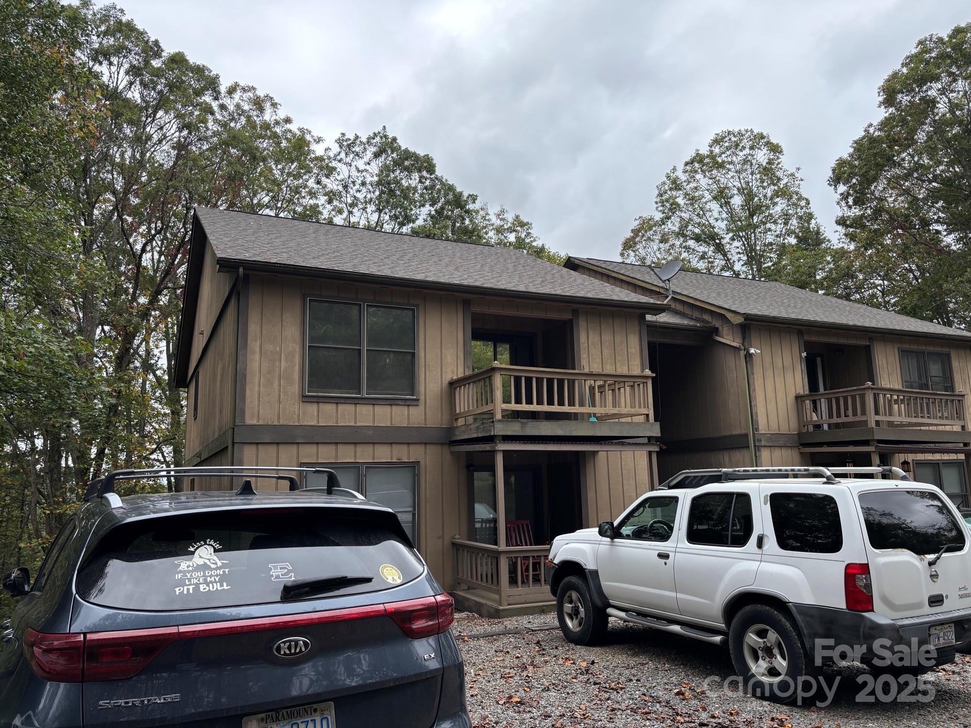 Come check it out. This open floor plan condo is just waiting for you. You will enjoy the spacious living room, dining room and kitchen, perfect for entertaining friends and family. The living area is graced with a beautiful stone fireplace complete with gas logs giving you a great backup heat source or just enjoying on chilly days. The bedrooms are spacious with the primary having a nice walk-in closet and on suite bath. You will find the laundry conveniently located in the laundry closet in the hallway. This unit also has a nice, screened porch for sitting and enjoying the quiet neighborhood and fresh air. On the front you have a nice open deck off the primary bed room. This is a second-floor unit and has a no pet policy. Very conveniently located to doctors' offices, hospital, and downtown Spruce Pine. Just short drive to the Blue Ridge Parkway, Grassy Creek Golf Course recently updated, fishing streams, Penland School of Crafts and so much more. Come and make this your home.