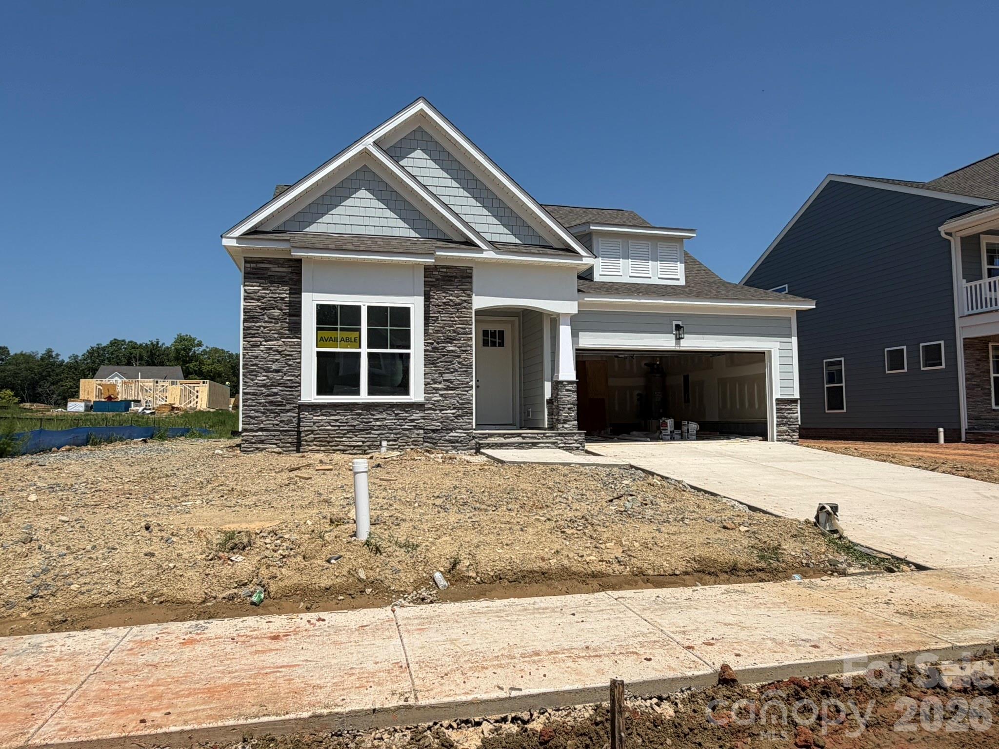 This beautiful Wescott is ready for you now! This ranch-style home has 3 bedrooms, 2 full baths, more than 2,000 square feet of one-level living space with beautiful outdoor 12x12 deck. The spacious primary suite is a true retreat with a tray ceiling, a luxury shower with semi-frameless door in the bathroom, a large walk-in closet, and an additional retreat room that also connects to the hallway at the garage entry. The main living area features the family room, breakfast area looking out onto the deck, and the kitchen with stainless appliances, white cabinets, and modern tile backsplash. This home also includes a formal dining room with tray ceiling, two additional bedrooms, a full bath with tub/shower combo, and laundry room. Other features include an electric water heater, quartz counters in all baths, and a tray ceiling in the foyer. Visit today and find out more!