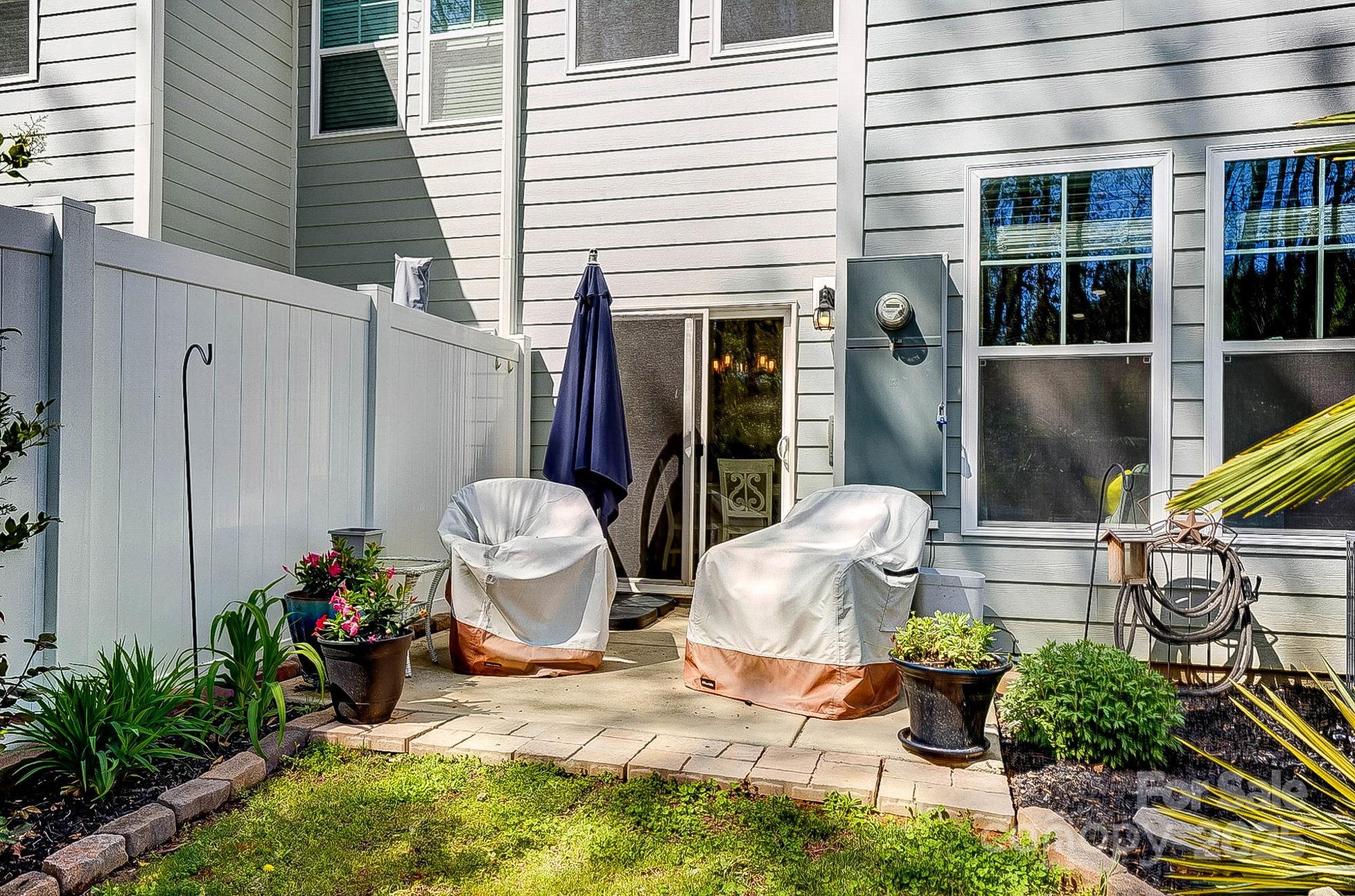 Move-In Ready Townhouse in Lake Wylie – Private Backyard & Wooded Views in the heart of Lake Wylie! This beautifully updated townhome offers modern touches & a serene setting. Step inside to find brand-new carpet & lvp flooring, beauitful mouldings, & updated 1/2-bath for a fresh, stylish feel. The spacious, open-concept living area flows into the kitchen w/ ample cabinetry & modern appliances. Upstairs, the primary suite boasts a walk-in closet & ensuite bath, while two additional bedrooms provide plenty of space for guests, a home office, or family. The 1 car garage is a standout w/ its epoxy floor & freshly painted walls, offering a clean & polished look. Enjoy the outdoors from your charming front porch w/ peaceful wooded views, or relax in the private, fenced backyard— beautifully landscaped w/ ornamental plantings & backing up to a tranquil wooded area. Located just minutes from Lake Wylie’s recreational activities, shopping, dining, & top-rated Clover schools. Low SC taxes.
