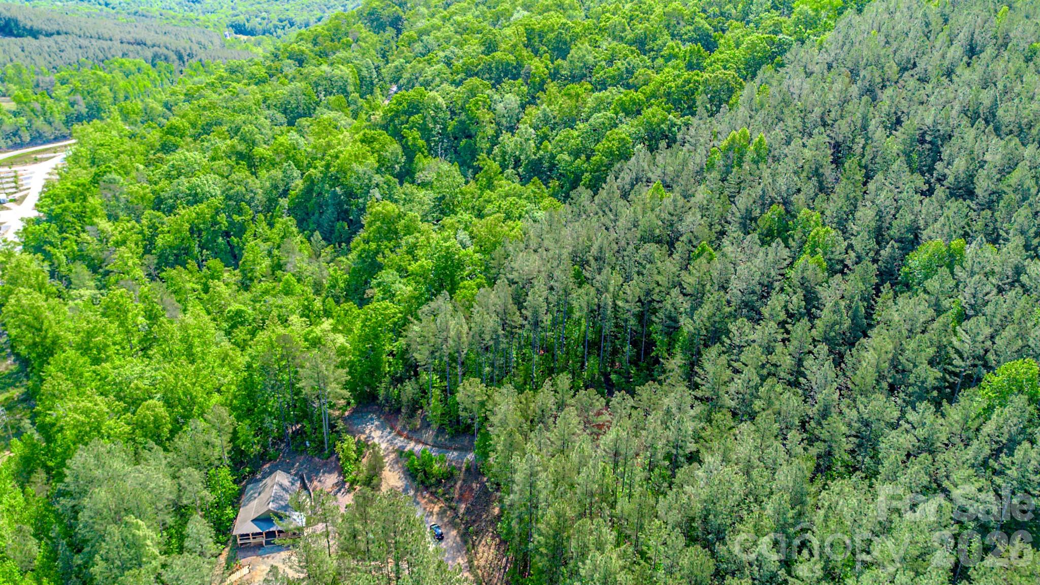 Now Offered at $49,900 – Fully Prepped 4.46 Acres in Fork Mountain

146 S Branch Drive in Bostic, NC is not just land… it’s a head start.

Set on a private corner lot in the quiet Fork Mountain community, this 4.46-acre homesite has already gone through the heavy lifting most buyers underestimate. The groundwork is done. The vision can start immediately.

Major improvements already completed:

200-amp underground electrical service installed
Extensive grading with approximately 90 loads of dirt removed
22 trees cleared to open up the homesite
17 loads of gravel added for access and stability
Fescue grass planted with erosion control in place

Whether you're planning a primary residence, mountain getaway, or RV setup, the property gives you flexibility without the usual delays. RV use is allowed, and the minimum build requirement is just 800 square feet… keeping your options open.

You get the privacy people want in the mountains, without feeling isolated.

Location advantages:

Minutes to Yogi Bear’s Jellystone Park
Close to South Mountains State Park
Convenient access to Forest City and Lake Lure
Easy connection to Hwy 74 for commuting

 Just a modest $200/year for road maintenance.

Private gravel road. Quiet surroundings. Real usability from day one.

This is the kind of property buyers wait for… improved, priced right, and ready to move on.