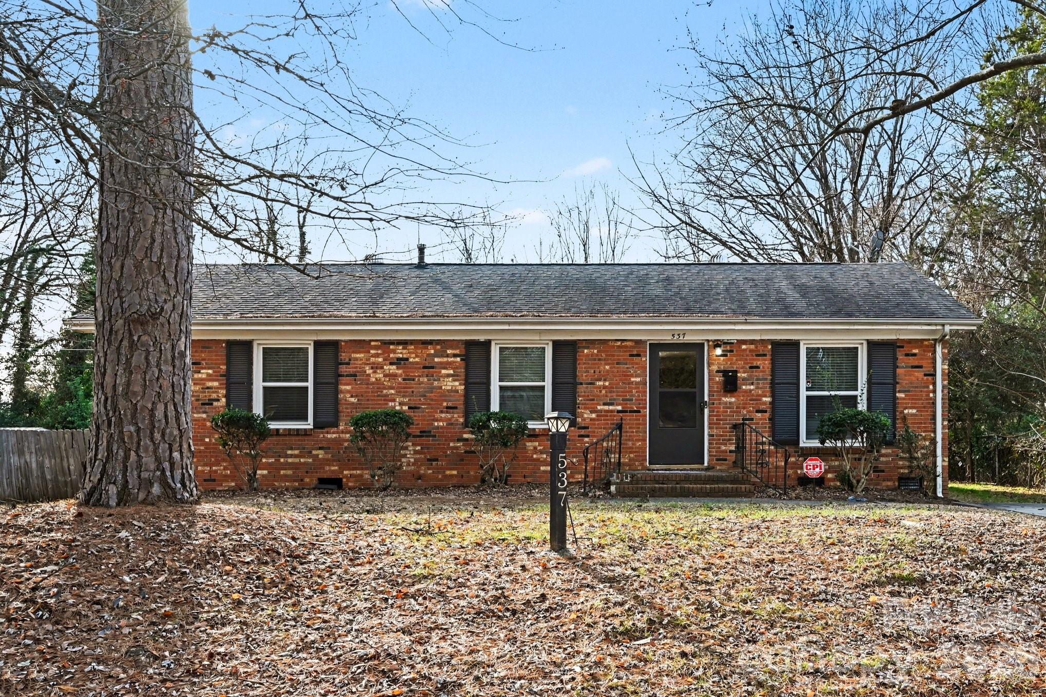 Beautiful brick ranch offering classic charm and comfortable one-level living. Original hardwood floors run throughout the den and bedrooms, adding warmth and character. The spacious kitchen features handsome cabinetry, stainless steel appliances, abundant natural light, and an open layout ideal for everyday living and entertaining. Step outside to a level, backyard that is perfect for gatherings or relaxing evenings with friends. Conveniently located just 3.5 miles from grocery, shopping, dining, and I-85 Exit 41, providing easy access to surrounding areas while maintaining a peaceful neighborhood feel. Timeless appeal and practical convenience. Make this your home today!