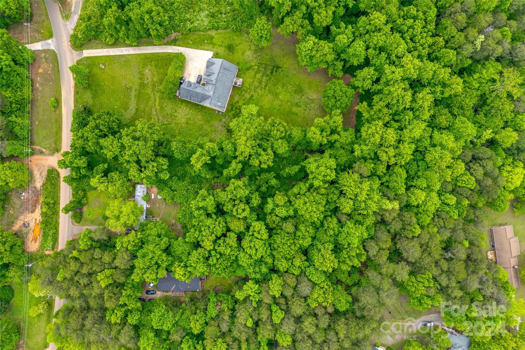 Conveniently situated just off Charlotte Highway (Hwy 49) within walking distance to Nanny Mountain, this property boasts a stunning 2.28-acre lot providing both privacy and the advantages of a subdivision without HOA fees. Explore the potential of this ideal homesite. Please note, there is a tenant currently residing in the manufactured home on the premises, who is open to staying or vacating before closing. The manufactured home is being sold as is, with no assigned value. Additionally, the property already features a well and septic system in place for added convenience. Contact us now and make it yours today!