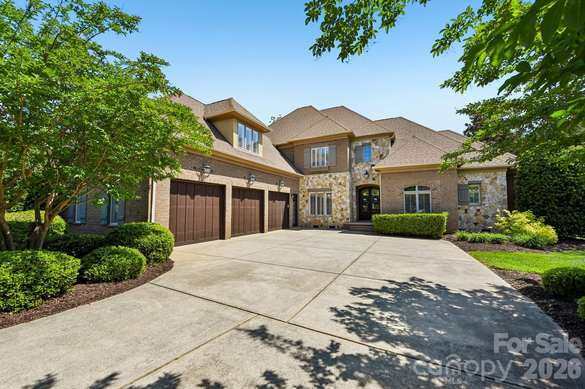 Exquisite Luxury Estate in Longview | Gated Golf Course Living.  New price New Life!
Experience the pinnacle of sophisticated living in The Club at Longview, Union County’s premier gated community featuring the region’s only Jack Nicklaus Signature golf course. This meticulously maintained estate offers a rare primary-on-main layout plus a secondary main-level guest suite—perfect for multi-generational living or refined hosting. Step through elegant glass doors into a sun-drenched floor plan highlighted by pristine hardwoods, plantation shutters, and fresh neutral paint. Formal dining room and living room / office aside the foyer and stunning 2 sty greatroom with gas fireplace. Windows from floor to ceiling bring the outdoors in. The chef’s kitchen is a showstopper, boasting updated white cabinetry, gas cooktop, designer backsplash, and modern lighting, all flowing seamlessly into a cozy keeping room plus casual dining area. Retreat to the expansive primary suite where floor-to-ceiling windows frame serene, private backyard views. The spa-like bath features a separate soaking tub, tiled shower, and dual walk-in closets.  The upper level expands your living space with a loft/desk area,  three generous bedrooms and a massive bonus/bedroom (over 544 sqft)with built-in shelving and closet—ideal for a home theater or fitness studio. Outside, dual terraces provide the ultimate setting for al fresco dining and grilling overlooking a private tree-lined rear yard. Zoned for the highly-coveted, top-ranked Marvin Ridge schools. Residents enjoy world-class amenities including a manor-style clubhouse, resort-style pools, tennis, and a family activity center.  Social membership required, Golf membership optional and available, tours are available!  Easy access to amenities on path that goes under Tom Short Rd. Home warranty and transferable termite bond for complete Peace of Mind!  Don't wait, today is the best day to start enjoying the good life!