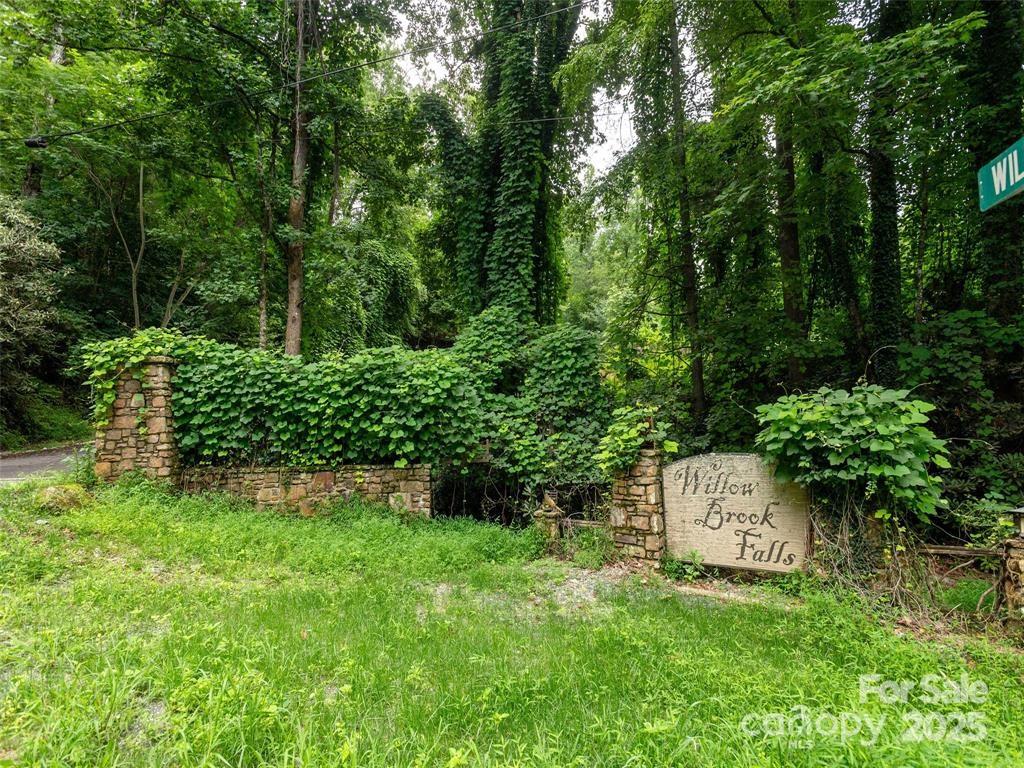 Beautiful wooded lot in Willow Brook Falls Community, this community offers seclusion and natural, untouched aesthetics. Convenience, with amenities just 7 minutes away in Downtown Hendersonville—less than a 1/4 mile away from Champion Hills Country Club, in the pristine Western North Carolina Mountains. Bring your dream home plans; depending on where you would like to place the home, mountain views might be accessible. Becomes part of the bigger picture, this subdivision is available for sale. See MLS# 4286495 for more information.